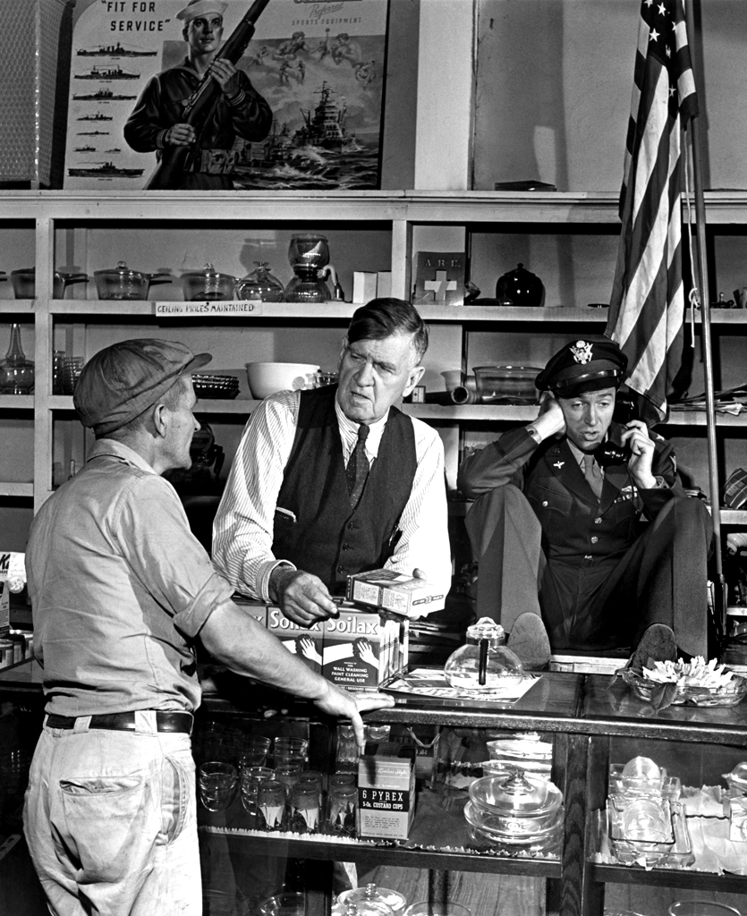 Jimmy Stewart on the phone at his father's hardware store, 1945.