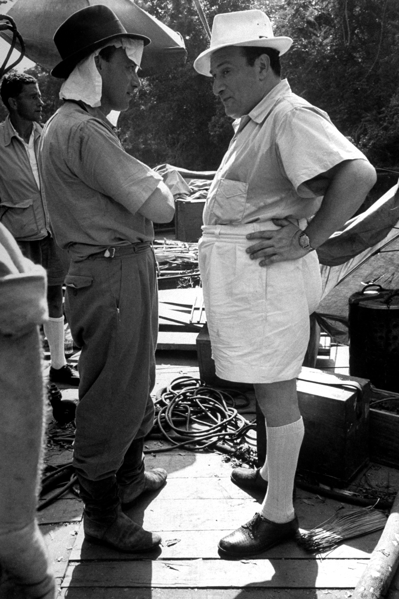 Chief cameraman Jack Cardiff and producer Sam Spiegel discuss technical specifications during filming of The African Queen. Spiegel went on to produce 1962's Lawrence of Arabia, which won the Oscar for Best Picture.