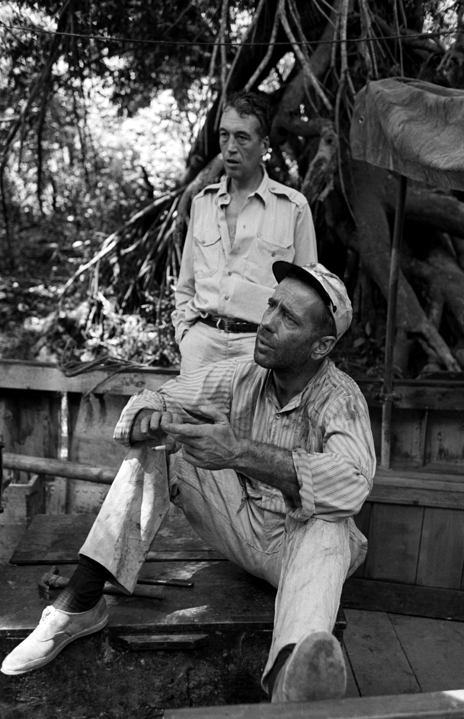 Director John Huston and Humphrey Bogart during filming of The African Queen, 1951.