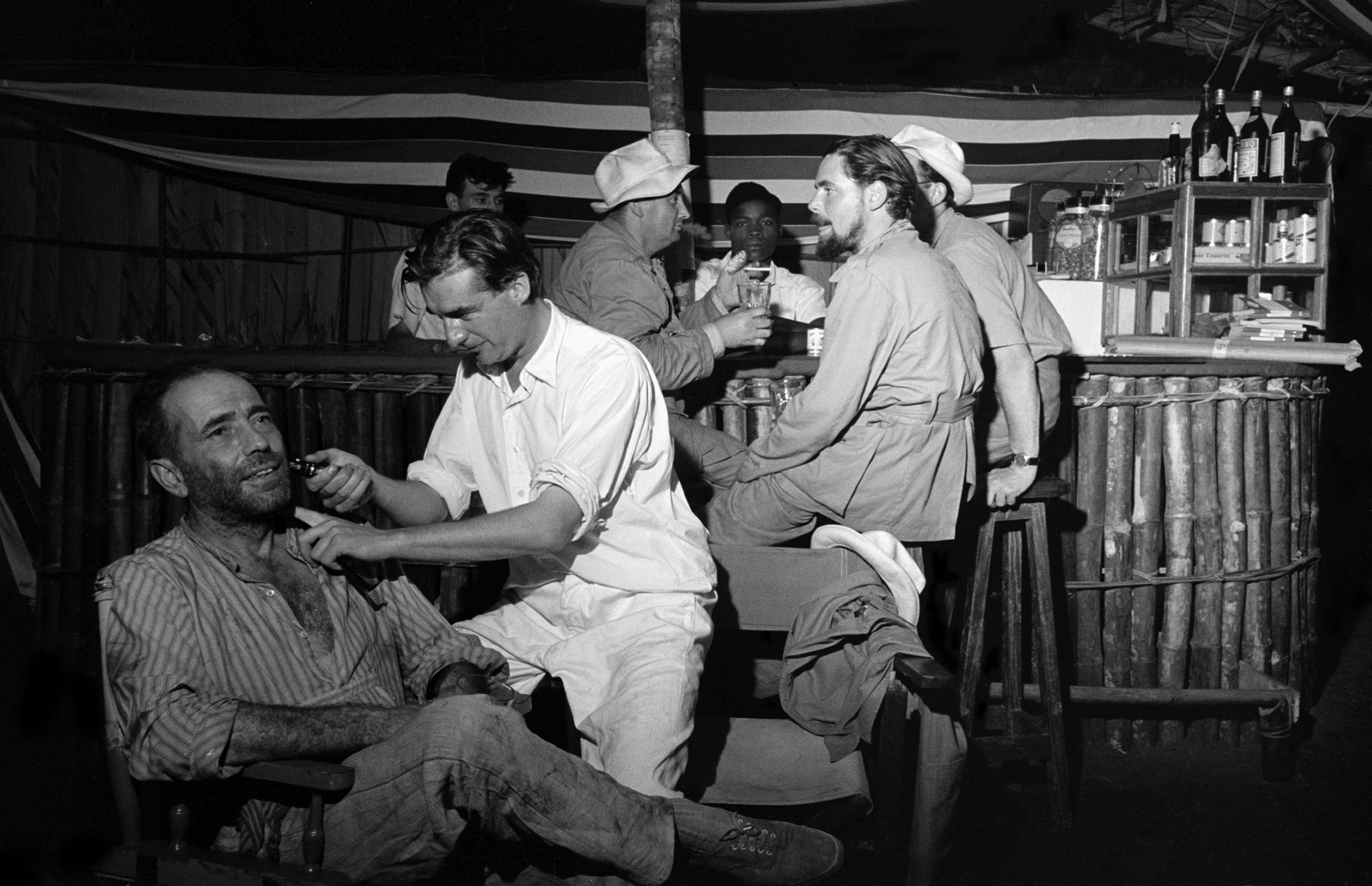 Humphrey Bogart's beard gets a touch-up during filming of The African Queen.