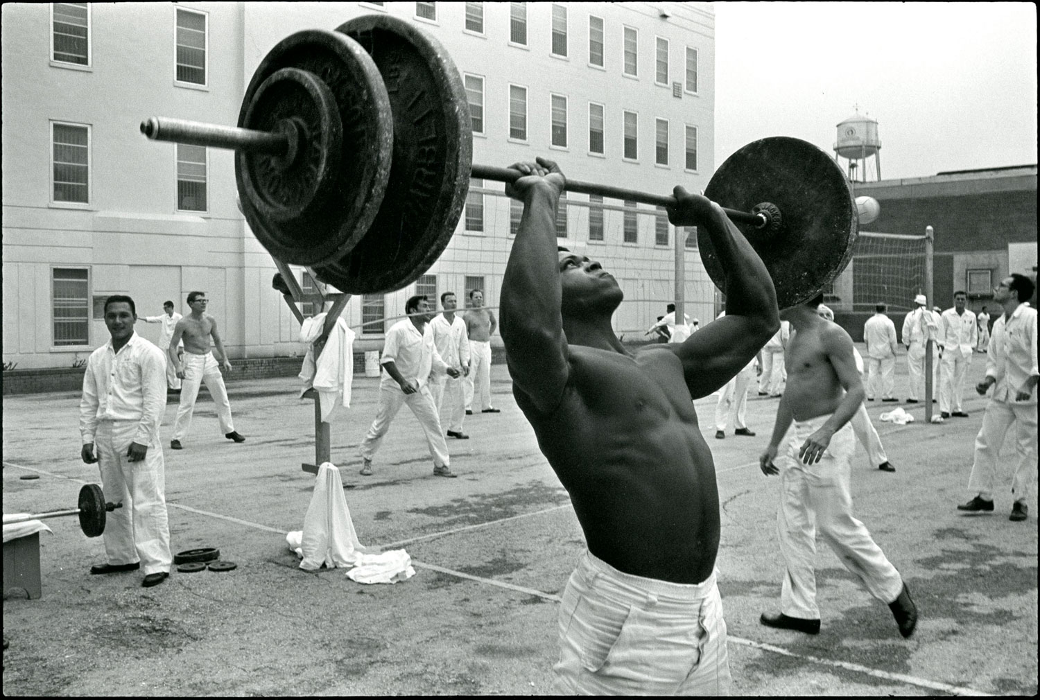 Lifting weights in the Walls yard, Huntsville, Texas, 1968