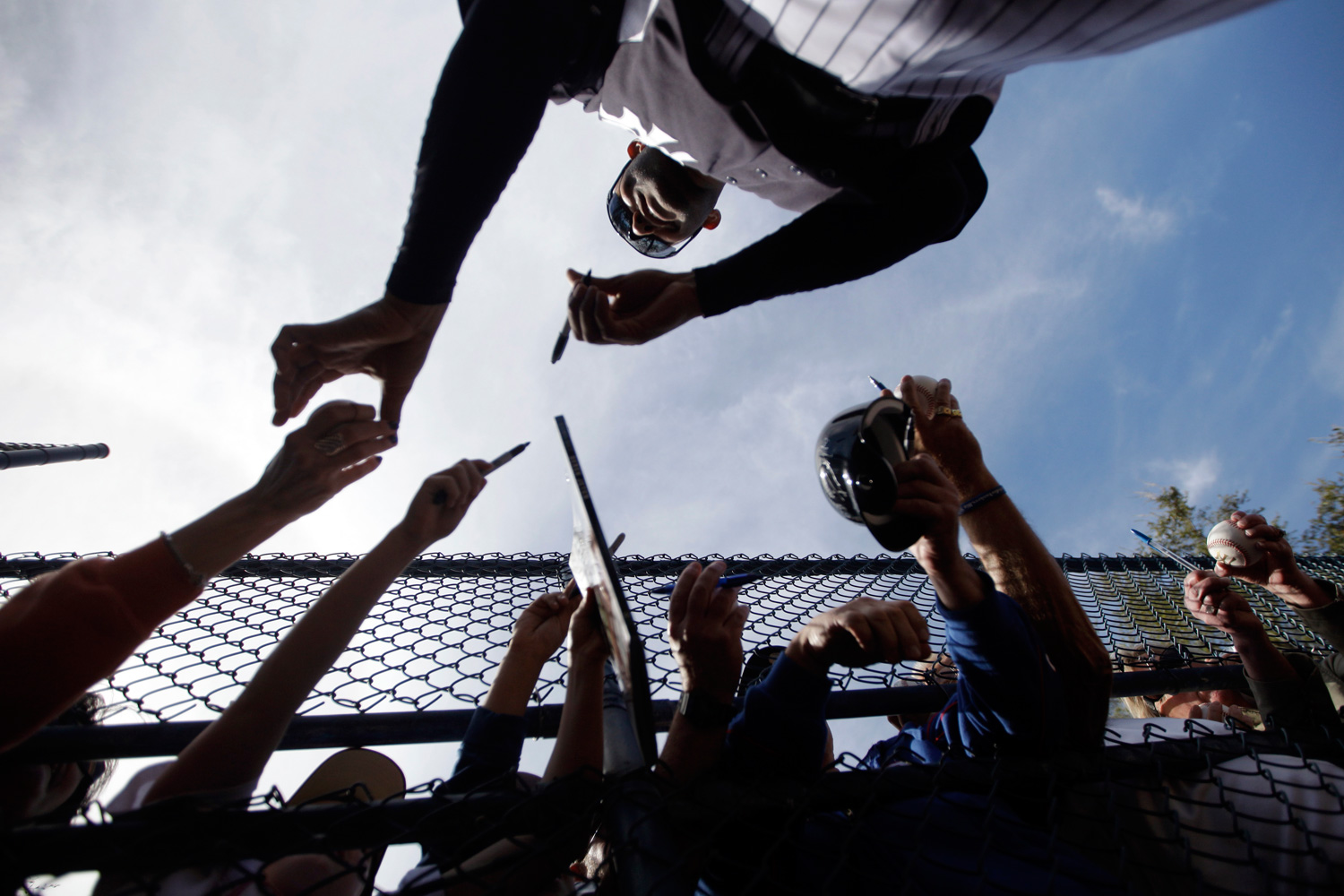 Feb. 20, 2012. New York Yankee Mariano Rivera signs autographs after practice at baseball spring training in Tampa, Fla.