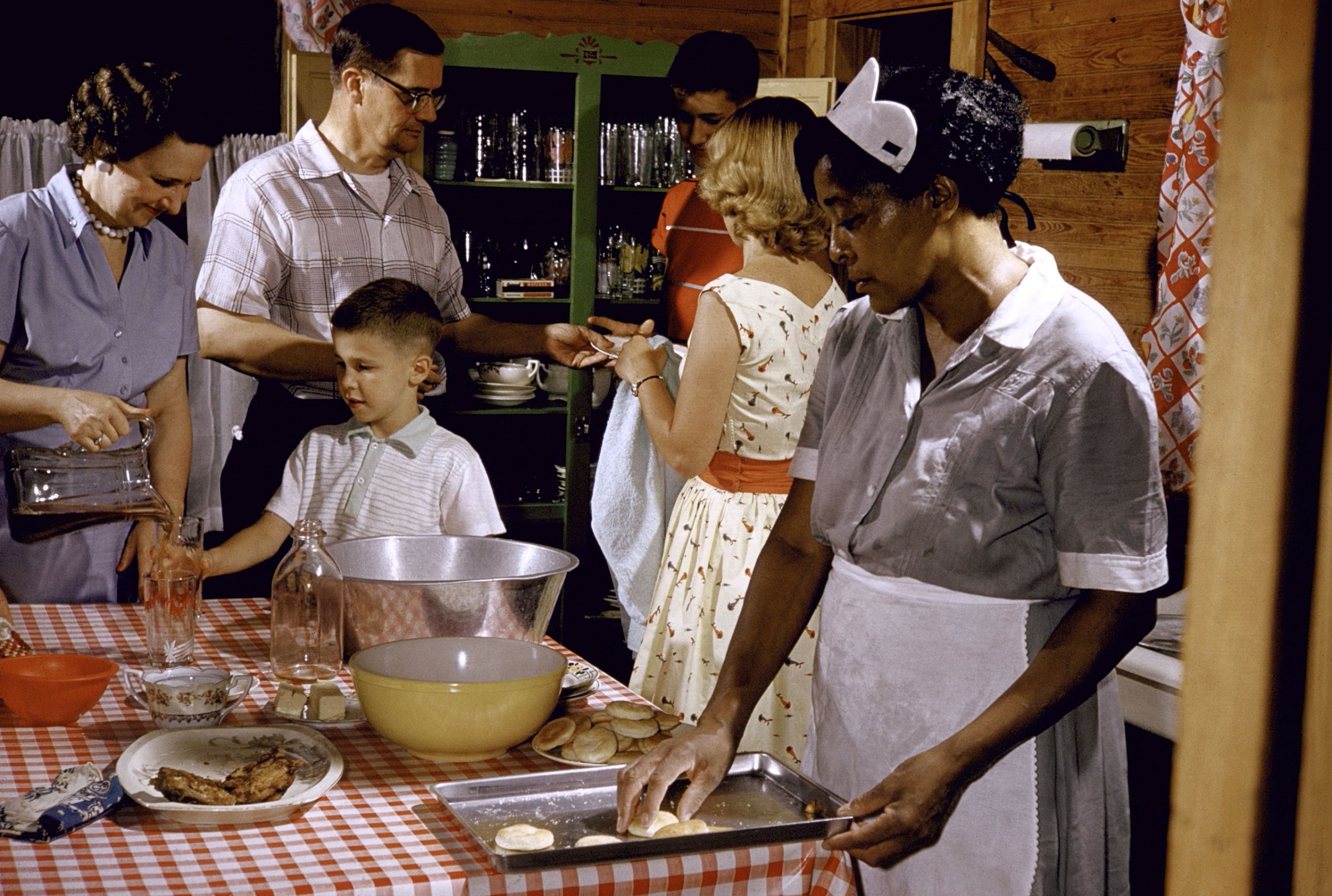 African-American maid prepares a white family's supper in Greenville, SC, 1956.