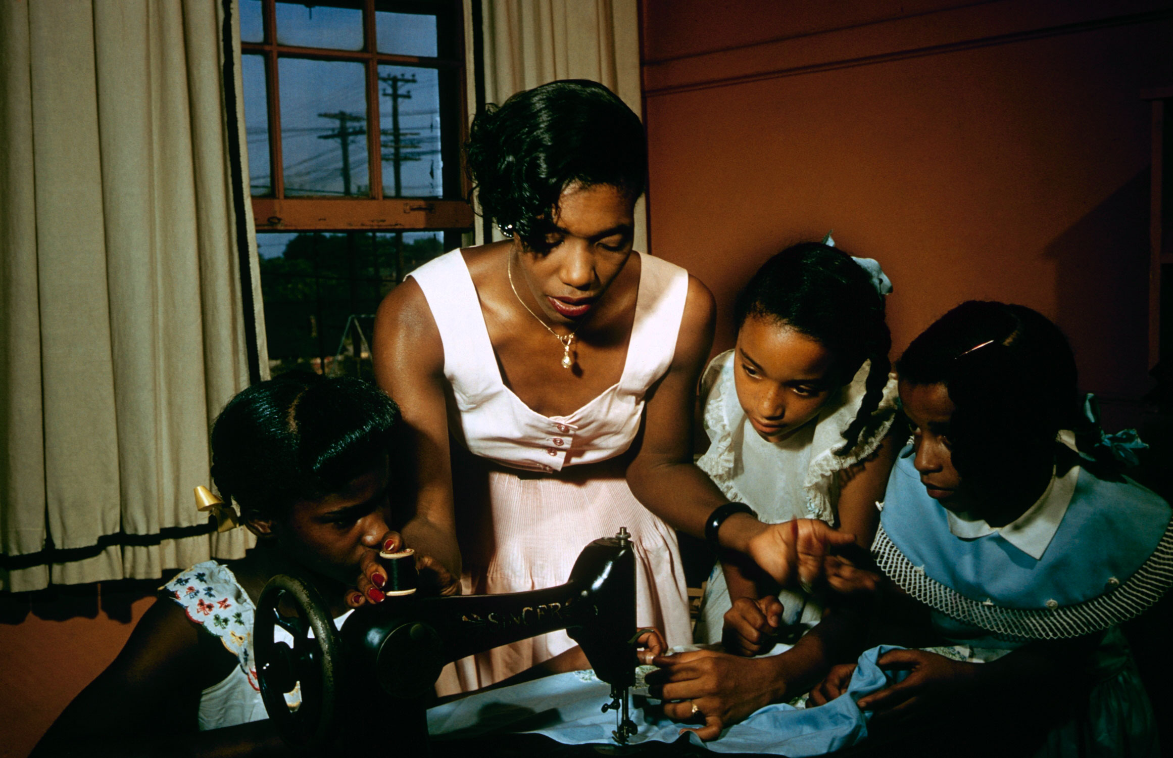 Young girls listen attentively in a sewing class, Greenville, S. Carolina, 1956.