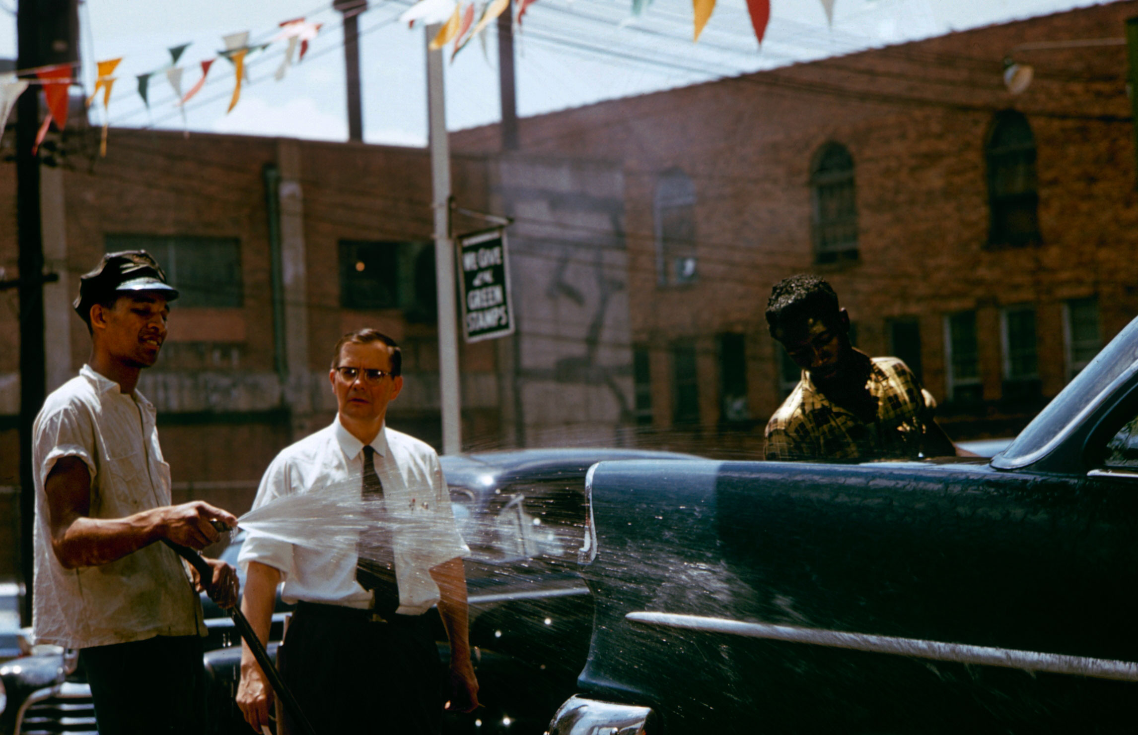Greenville, South Carolina's mayor Kenneth Cass (above, in tie) at a car wash, 1956.