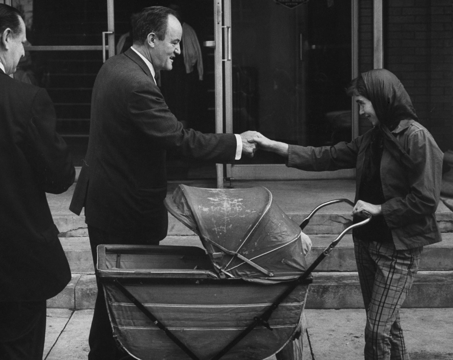 Hubert Humphrey shakes hands with a voter while campaigning prior to the West Virginia primary in April 1960.