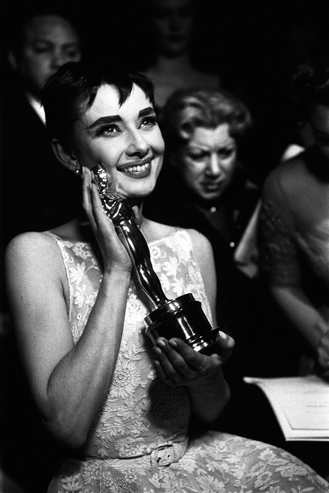 The one and only Audrey Hepburn cradles the Oscar she won for her role in Roman Holiday.
