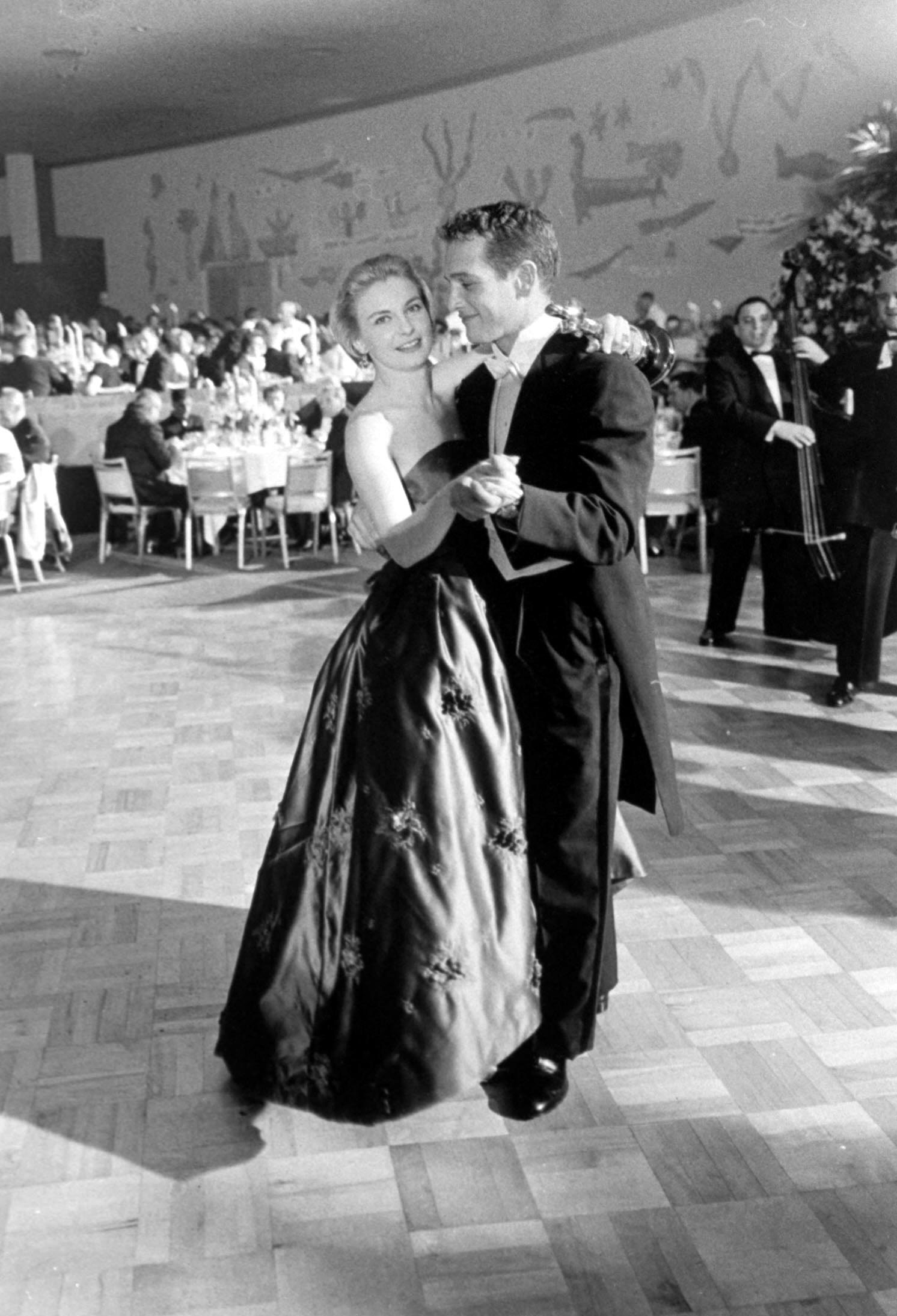 Joanne Woodward dances with her husband, Paul Newman, at the Governor's Ball following the Academy Awards where she won the Oscar for Best Actress in Three Faces of Eve