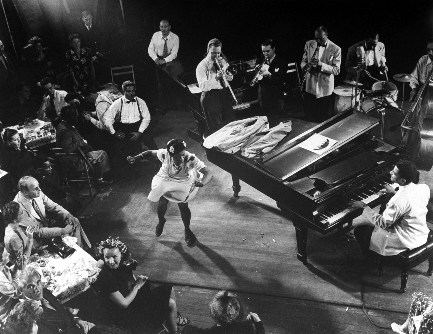 Pearl Primus performs to "Honeysuckle Rose" as played by an all-star group consisting of Teddy Wilson (piano), Lou McGarity (trombone), Sidney Catlett (drums), Bobby Hackett (trumpet) and John Simons (bass).