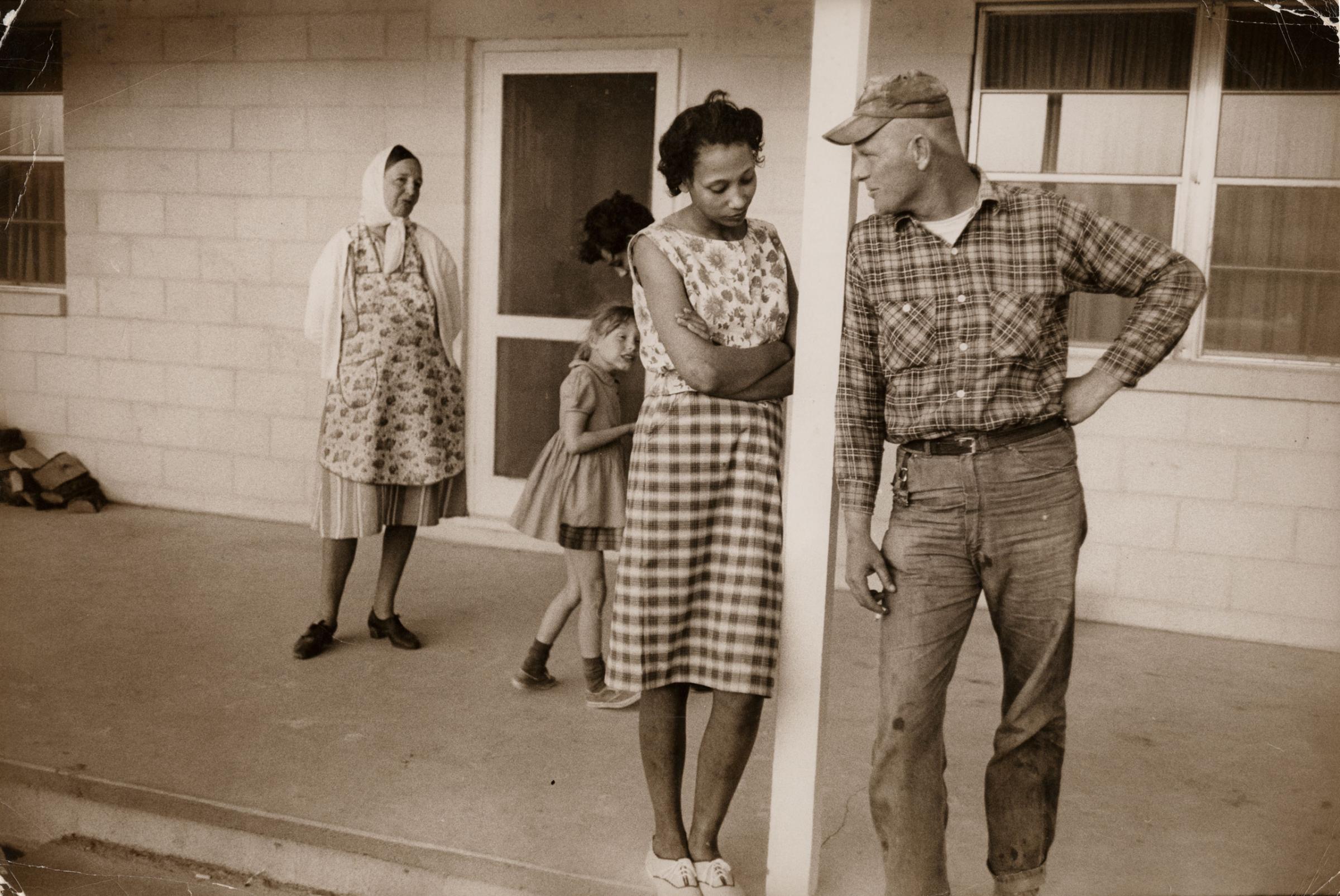 Mildred and Richard Loving, their daughter Peggy, Mildred’s sister Garnet, and Richard’s mother Lola, on the front porch of Mildred’s mother’s house, Caroline County, Virginia, April 1965.