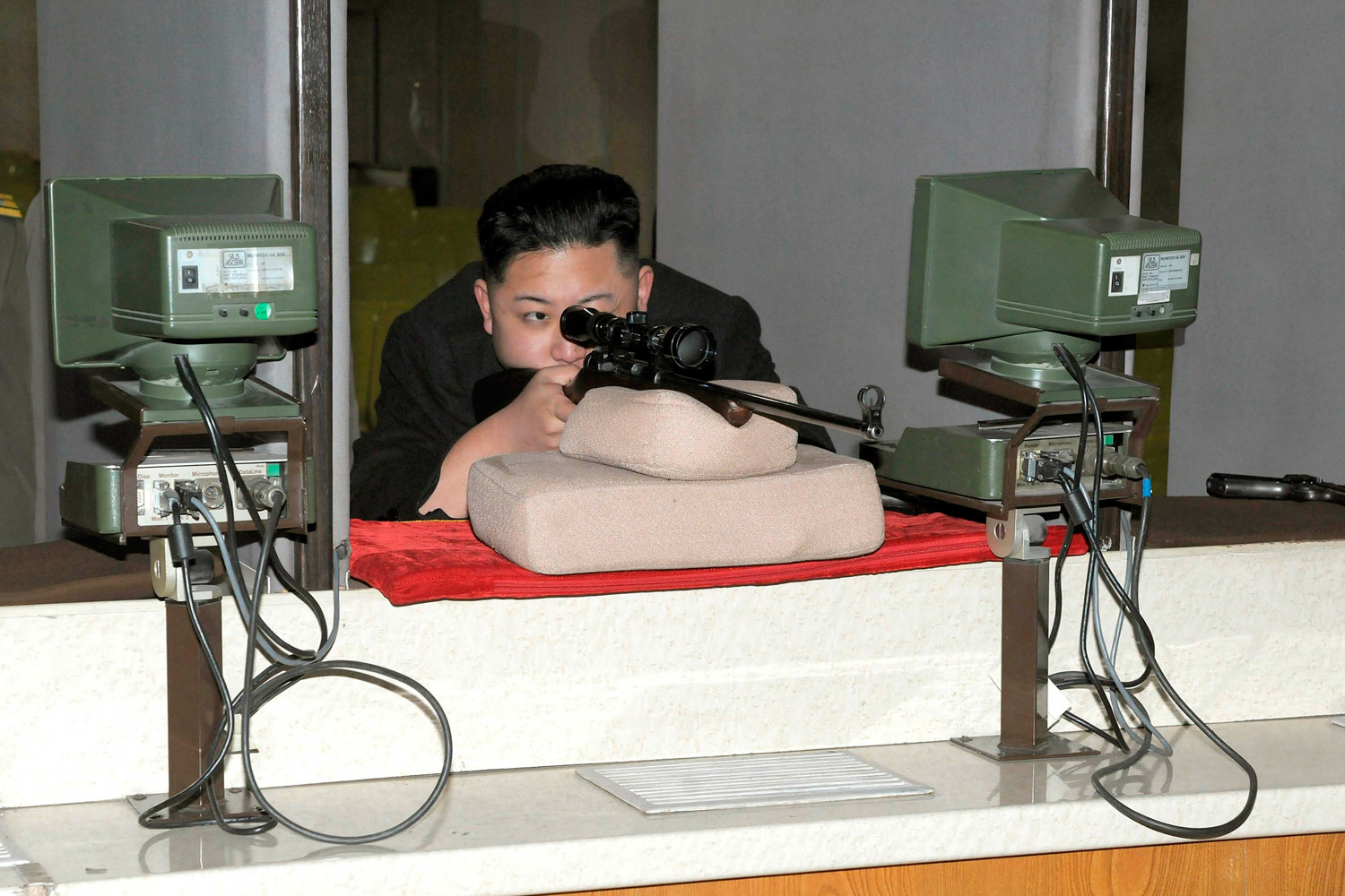 Feb. 23, 2012. North Korean leader Kim Jong-Un aims a rifle at the Sporting Bullet Factory, which was built in 1996 on the direct initiative of North Korea's late leader Kim Jong-il, in an undisclosed location in North Korea.