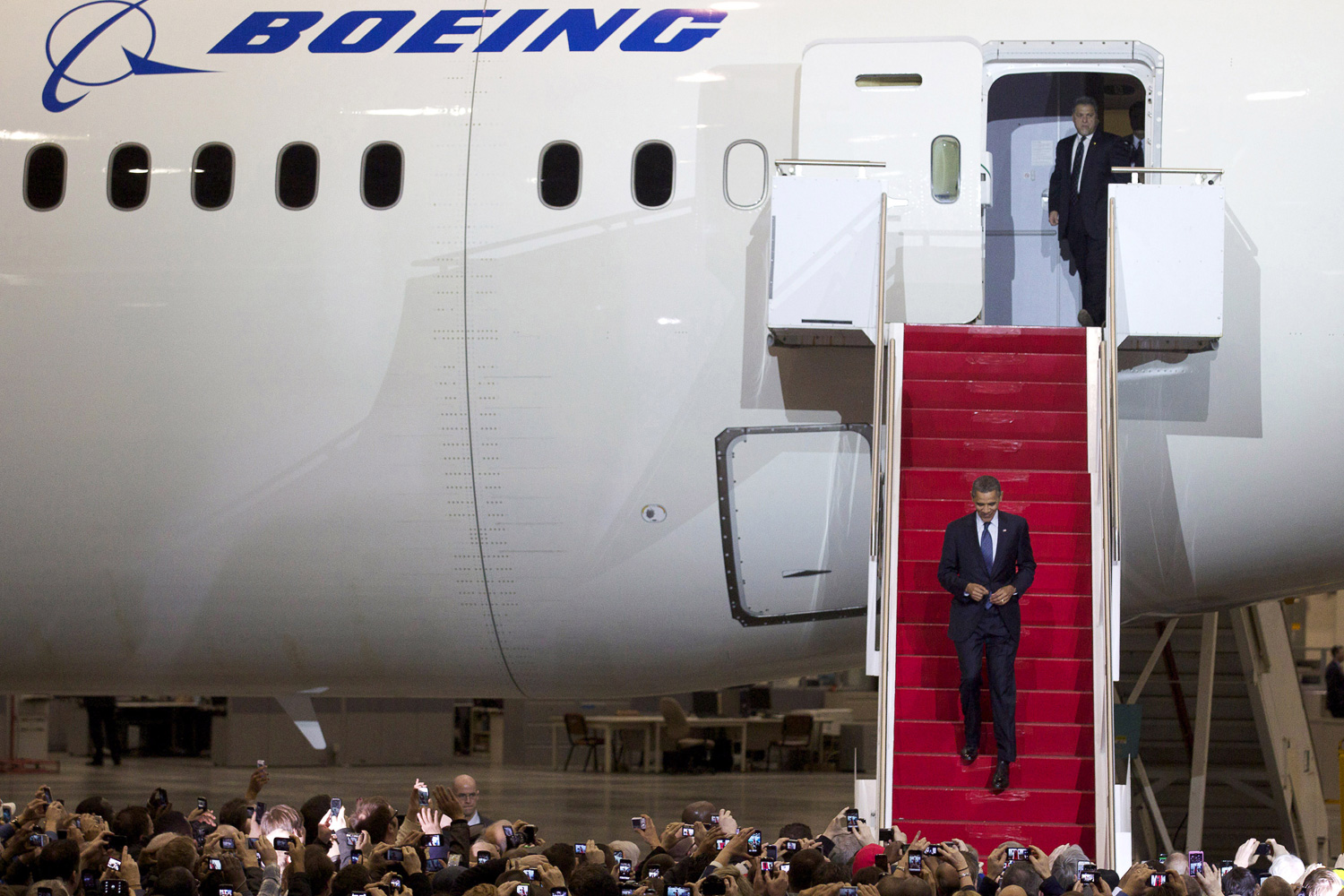Feb. 17, 2012. President Barack Obama walks down the stairs of a Boeing 787 Dreamliner before giving a speech on the Boeing 787 Dreamliner assembly line in Everett, Wash.