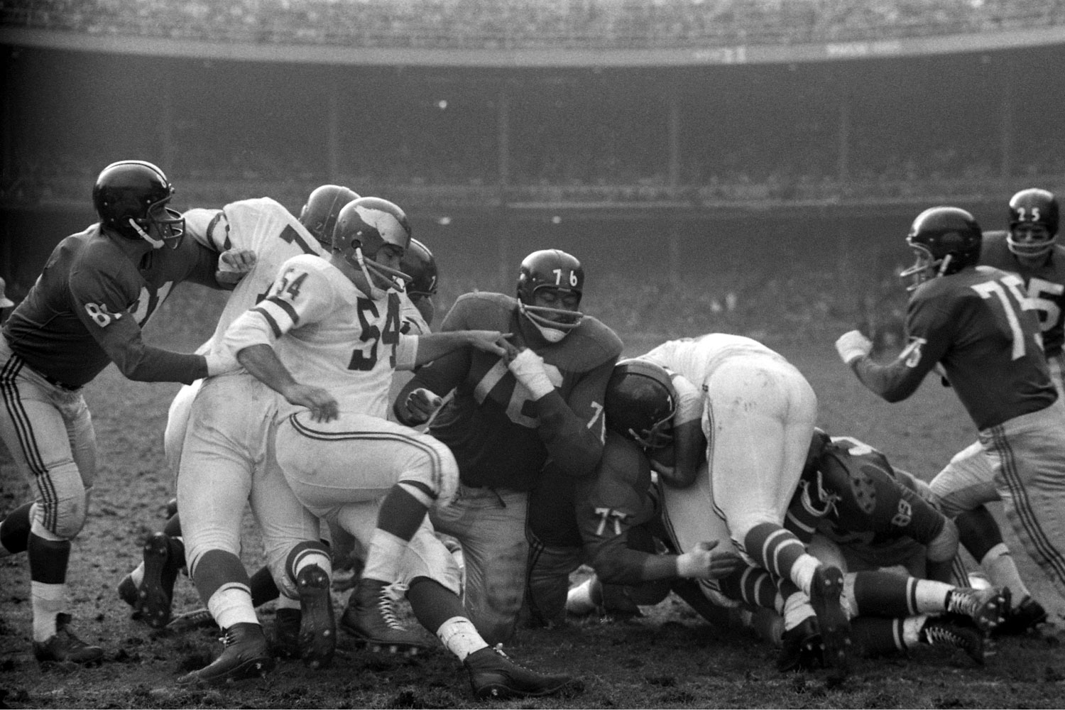 Rosey Grier (#76) finds himself in a familiar spot -- in the middle of the action during a 1960 game against New York's perennial rivals, the Eagles.