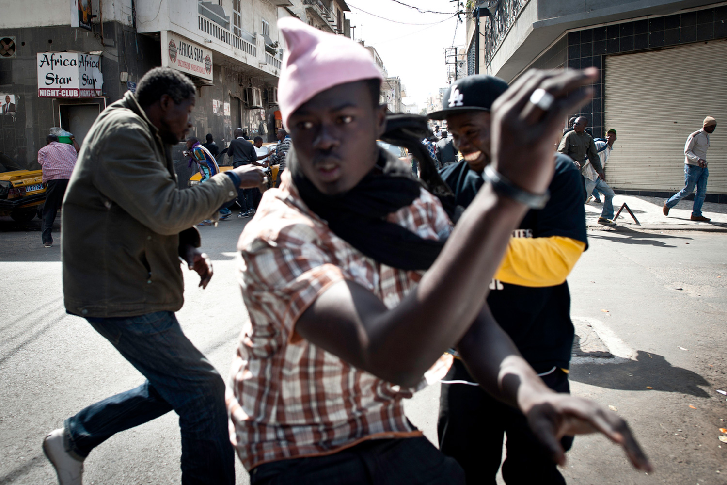 Feb. 17, 2012. Anti-government protesters and police clash in running street battles of rock throwing and tear gas in the streets of Dakar, Senegal.