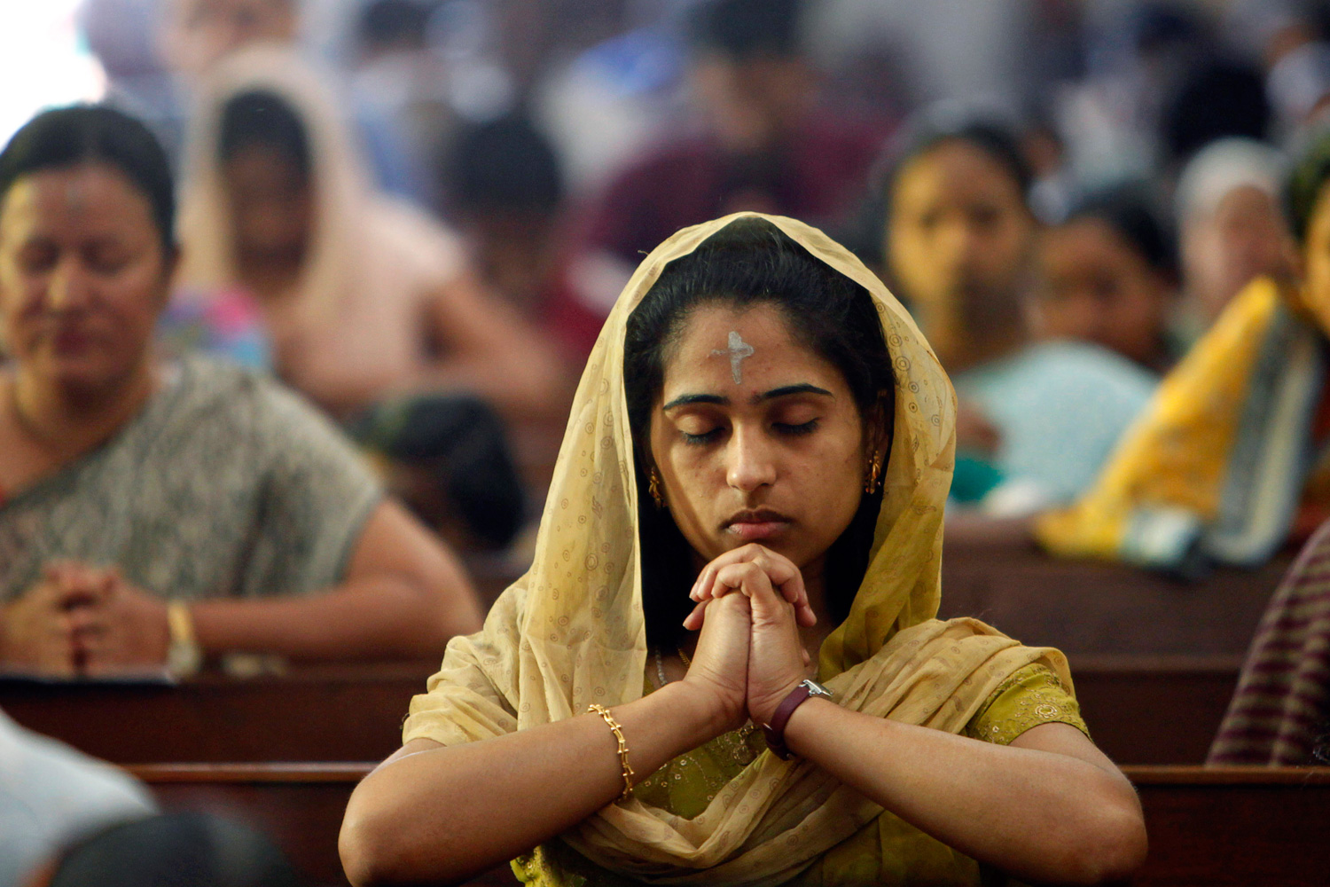 Feb. 22, 2012. Indian Christians offer prayers during a mass in observance of Ash Wednesday at a Catholic church in Hyderabad, India.