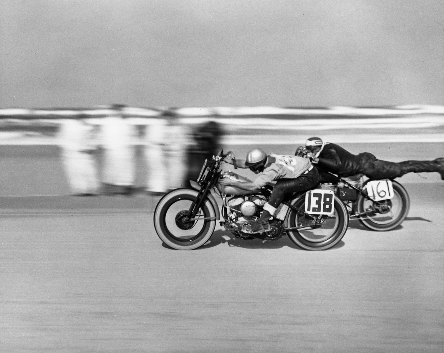 Number 161 Norman Teleford streamlines himself during a motorcycle race at Daytona Beach, March 1948.