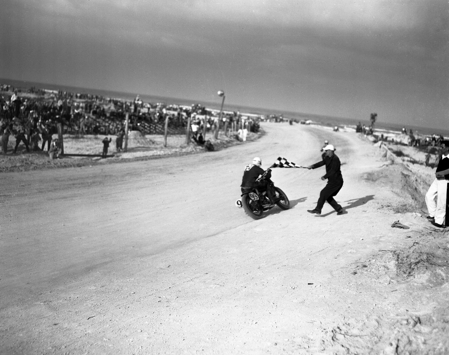 The checkered flag waves as Floyd Emde wins the 1948 Daytona 200.