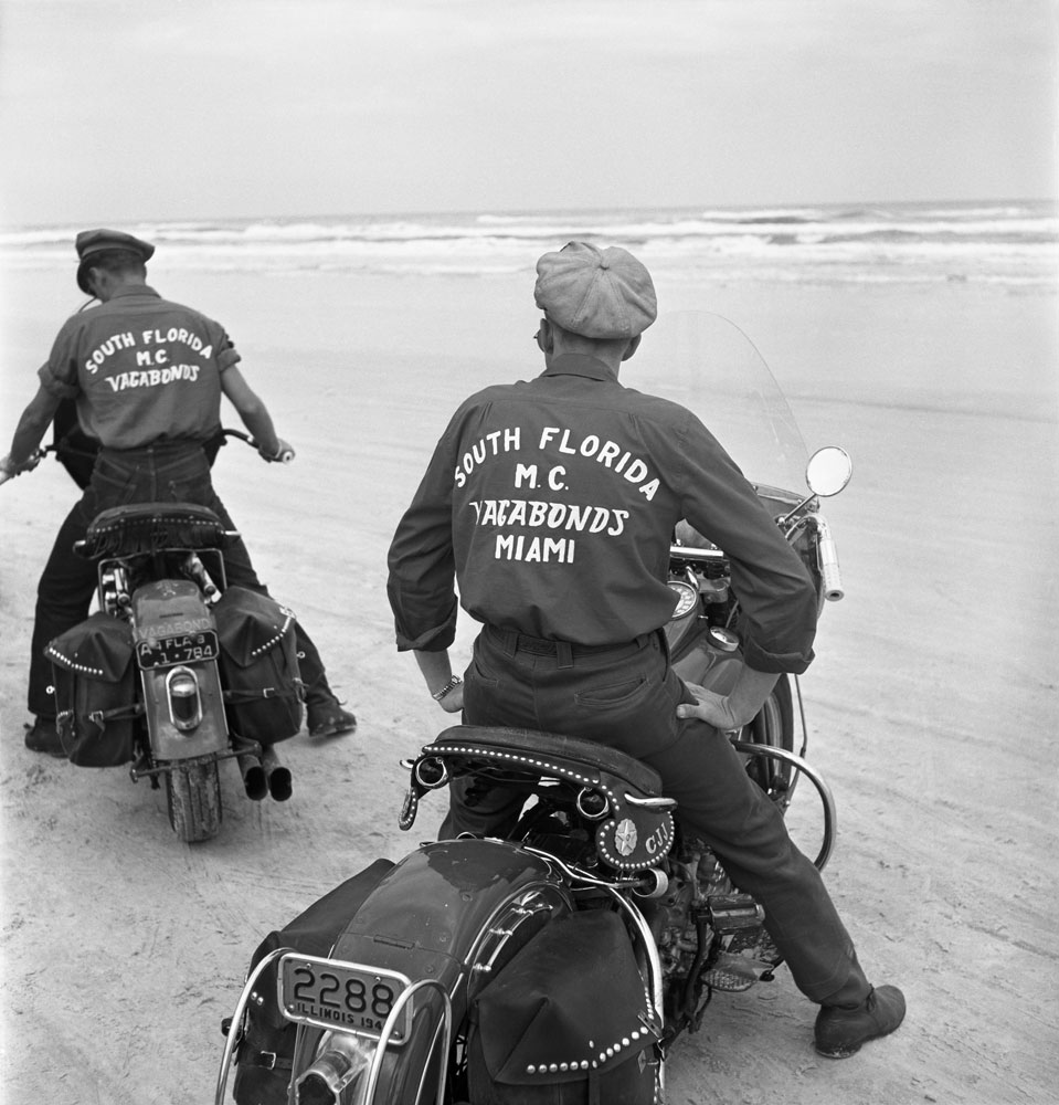 Two members of the South Florida Vagabonds motorcycle club drive on the beach during the Daytona 200 motorcycle race, Daytona Beach, Florida, March 1948.
