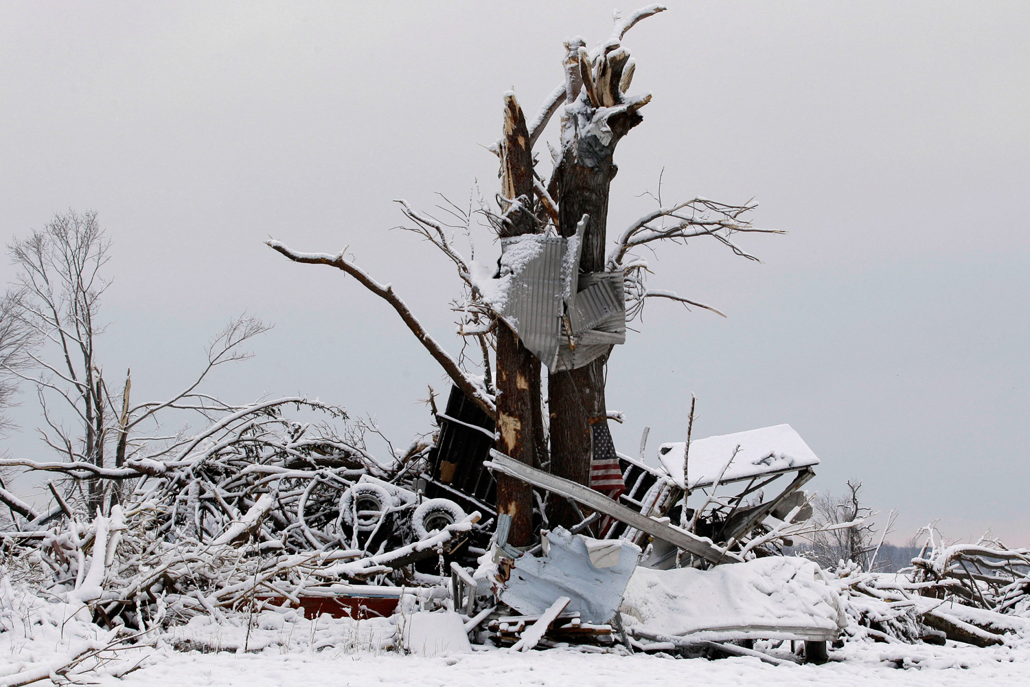 March 5, 2012. Snow covers a demolished house in Marysville, Ind., after a tornado ripped through the town.