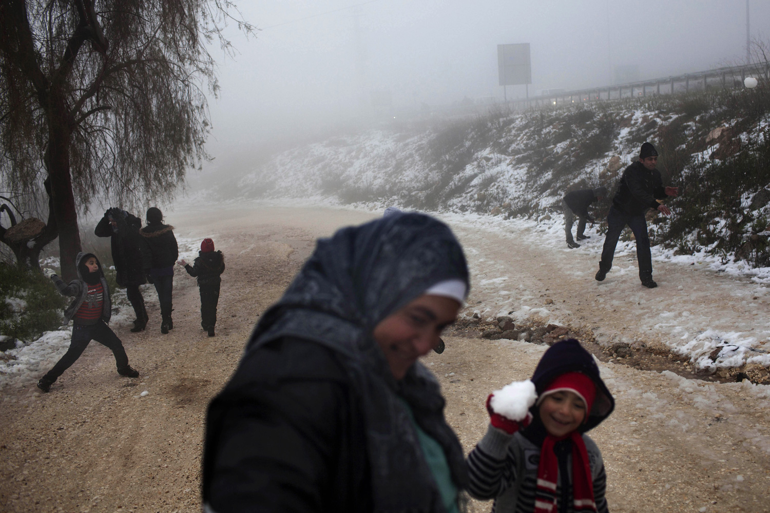 March 2, 2012. Palestinians play with snow near the West Bank town of Bethlehem.