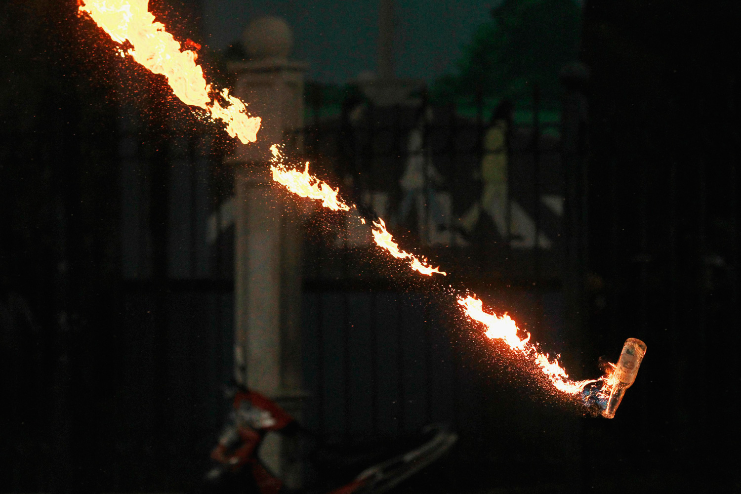 March 27, 2012. A Molotov cocktail is thrown during a clash between student protesters and the government against plans to raise fuel prices in Jakarta.