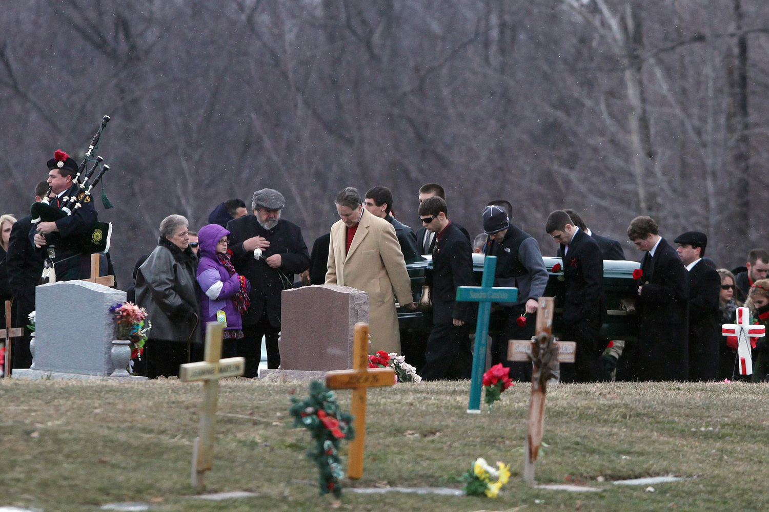 March 3, 2012. The casket of slain Chardon High School student Daniel Parmertor is carried to his gravesite in Chardon, Ohio.