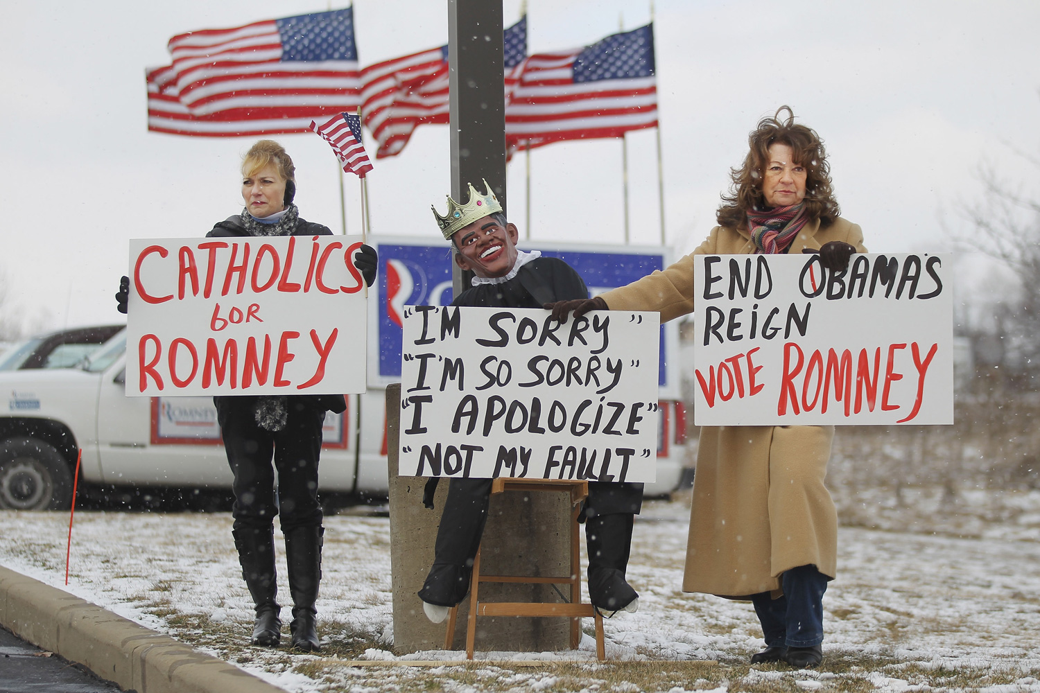 March 5, 2012. Supporters of Republican presidential candidate Mitt Romney stand with a puppet of President Barack Obama outside a Romney campaign rally at Taylor-Winfield Technologies in Youngstown, Ohio.