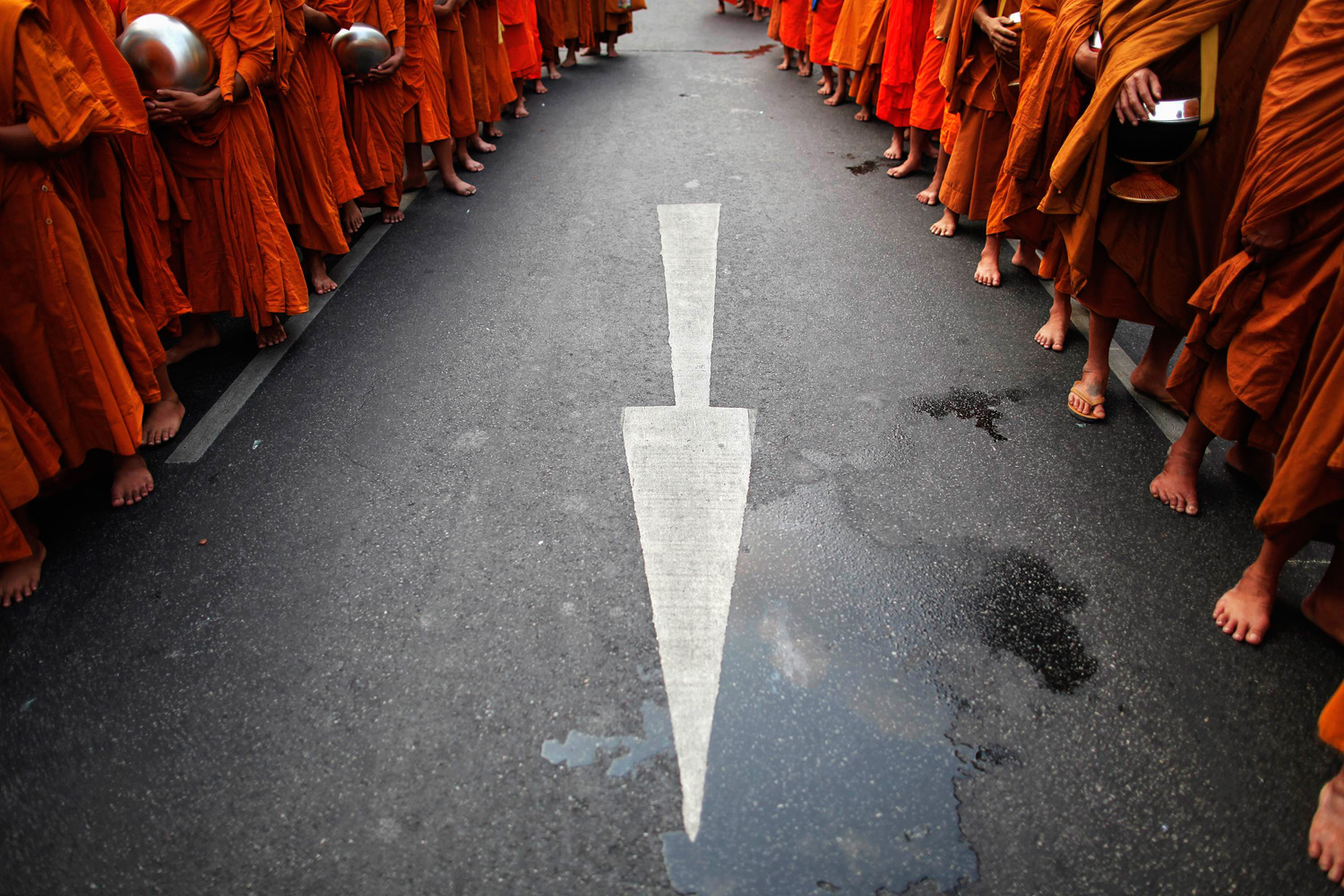 March 24, 2012. Some tens of thousands of Buddhist monks arrive for a mass alms-offering ceremony in Bangkok's Chinatown.