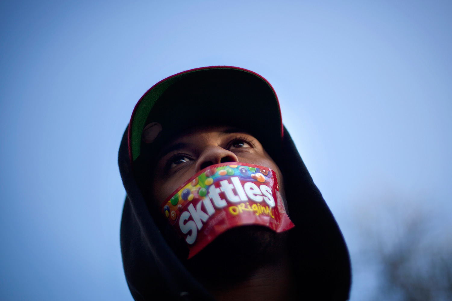 March 26, 2012. Jajuan Kelley of Atlanta wears a Skittles wrapper over his mouth during a rally in memory of Trayvon Martin, the unarmed 17-year-old who was killed by a Florida neighborhood watch captain while returning from a convenience store with a bag of Skittles and an iced tea.