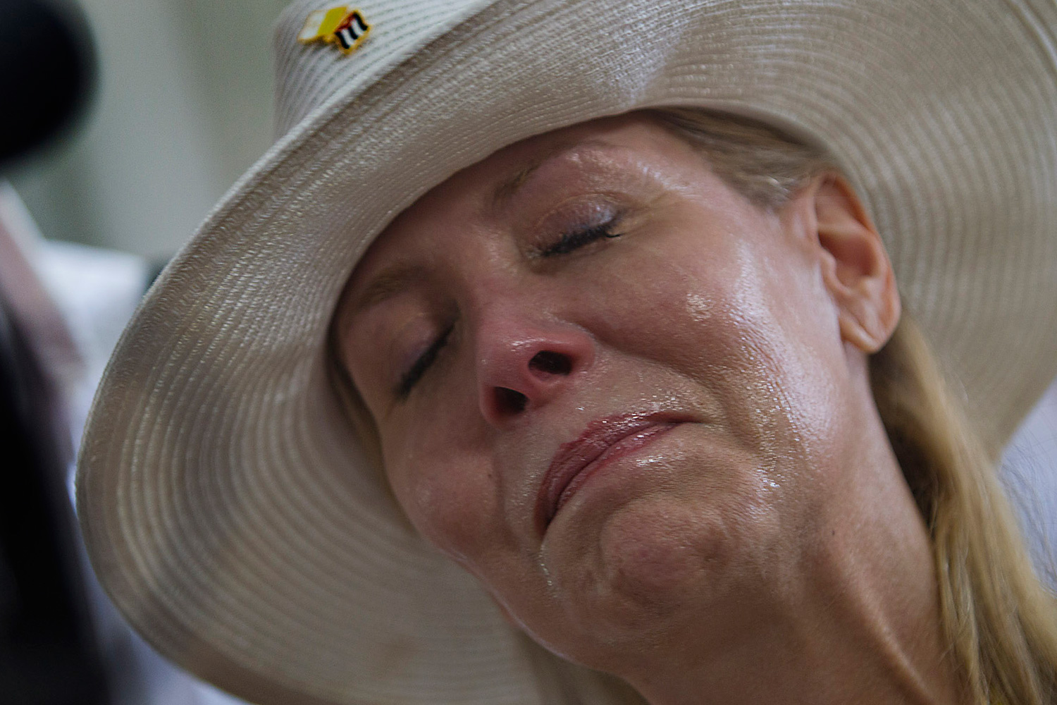 March 26, 2012. Laura Fabar-Equels is overcome with emotion as she visits the original statue of Our Lady of Charity, located in the Sanctuary of El Cobre prior to a mass by Pope Benedict XVI in the Plaza de la Revolucion Antonio Maceo in Santiago, Cuba.