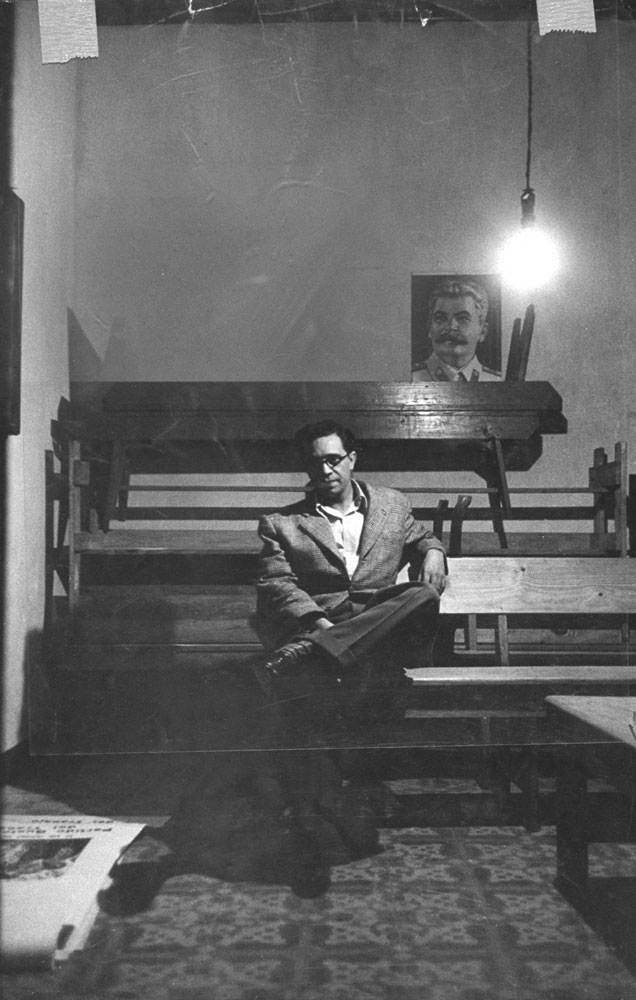 Jose Manuel Fortuny, Secretary of the Communist Party in Guatemala, sits under a portrait of Stalin in 1953.