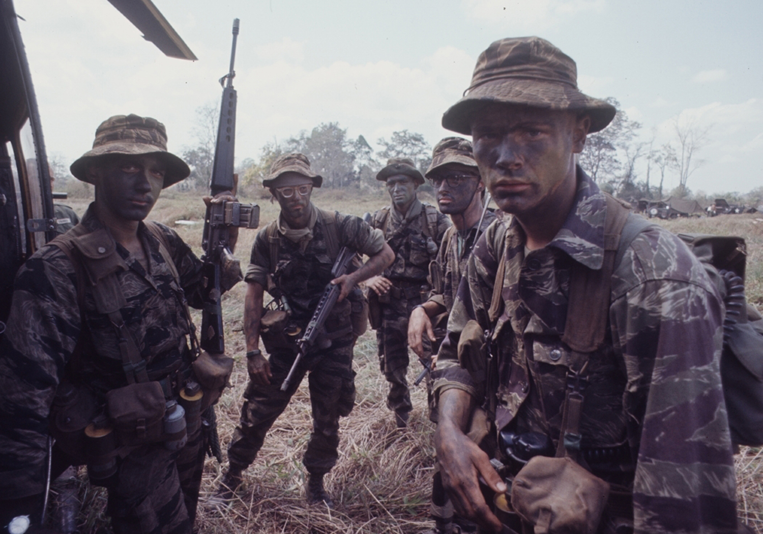 American soldiers of 2nd Battalion, 503rd Airborne Infantry, 173rd Airborne Division gear up for a long range patrol during Operation Junction City, a massive 1967 search and destroy operation in Vietnam.