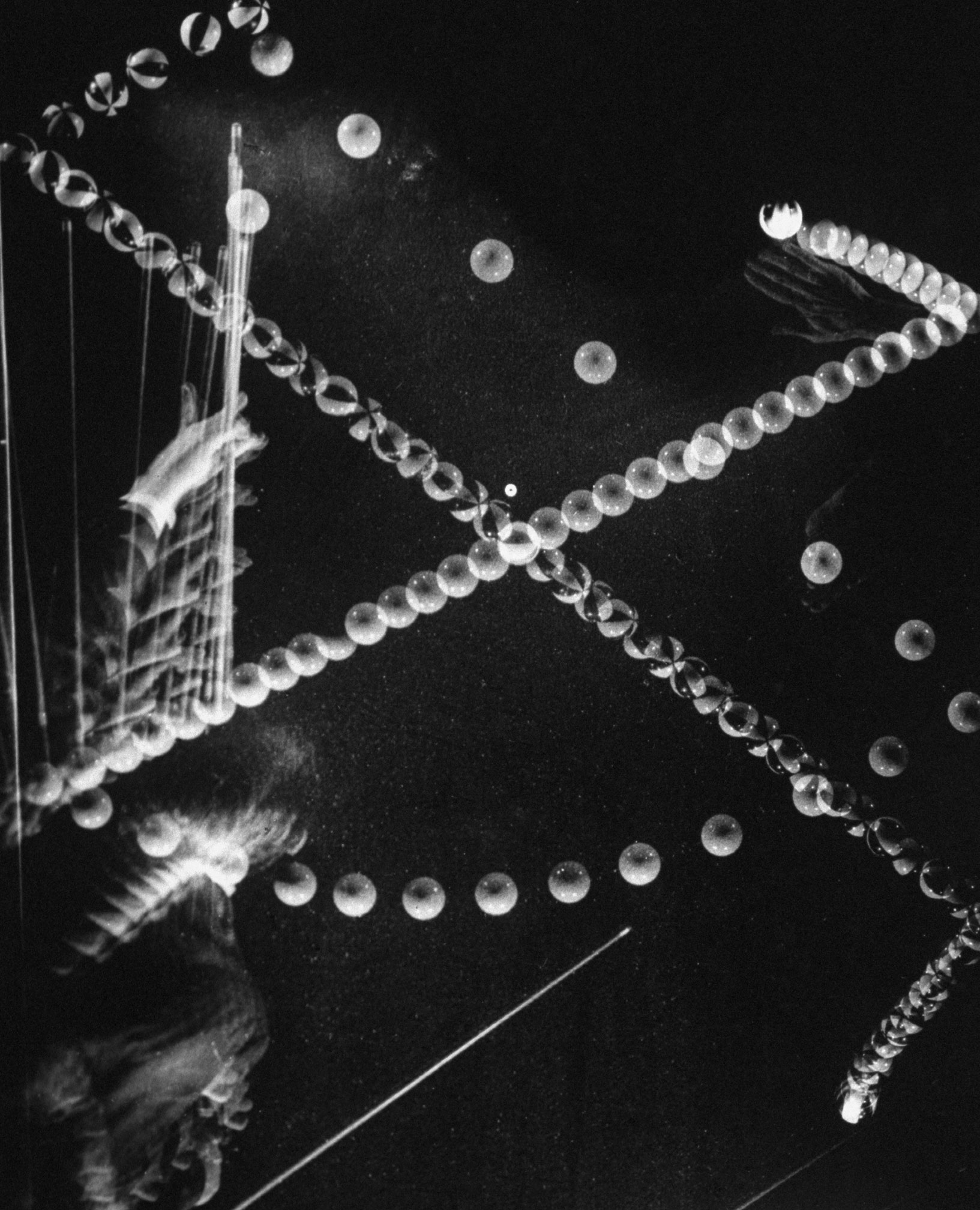 Stroboscopic image of a trick shot by billiards champion Willie Hoppe in 1941.