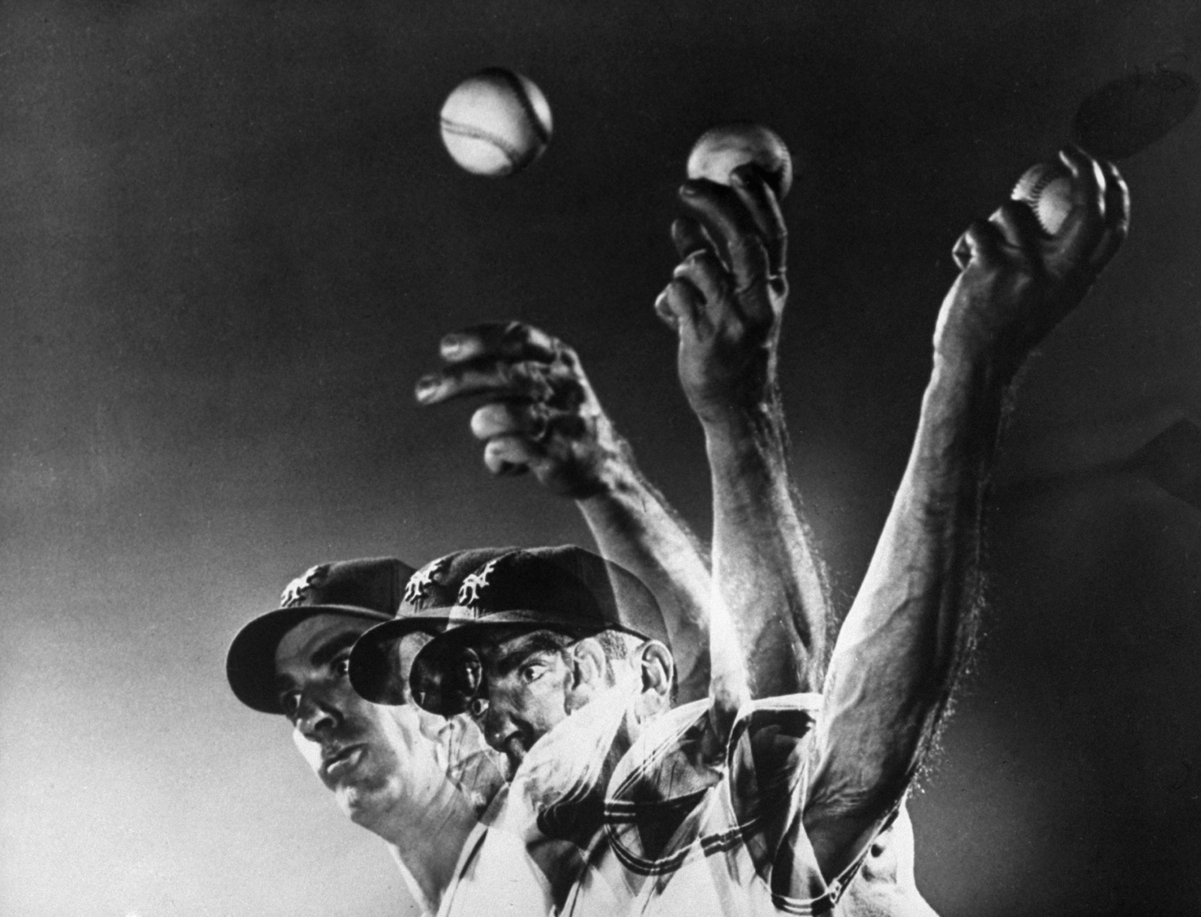 New York Giants pitcher Carl Hubbell throws a curve ball, 1940.