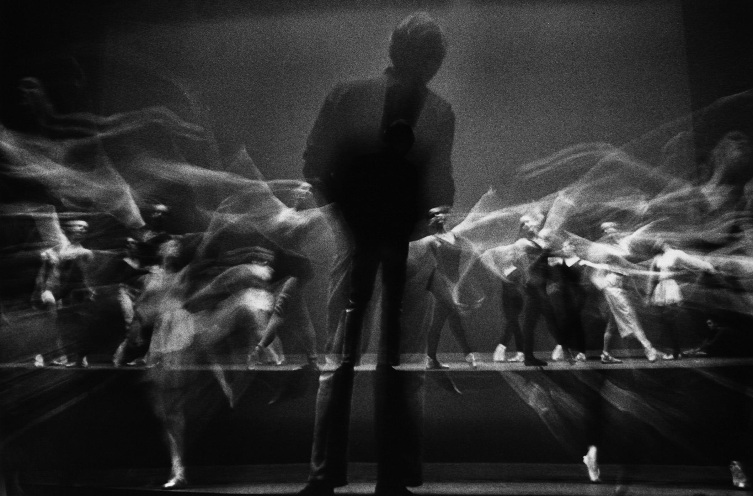 Stroboscopic image of choreographer George Balanchine watching New York City Ballet dancers rehearse in 1965.