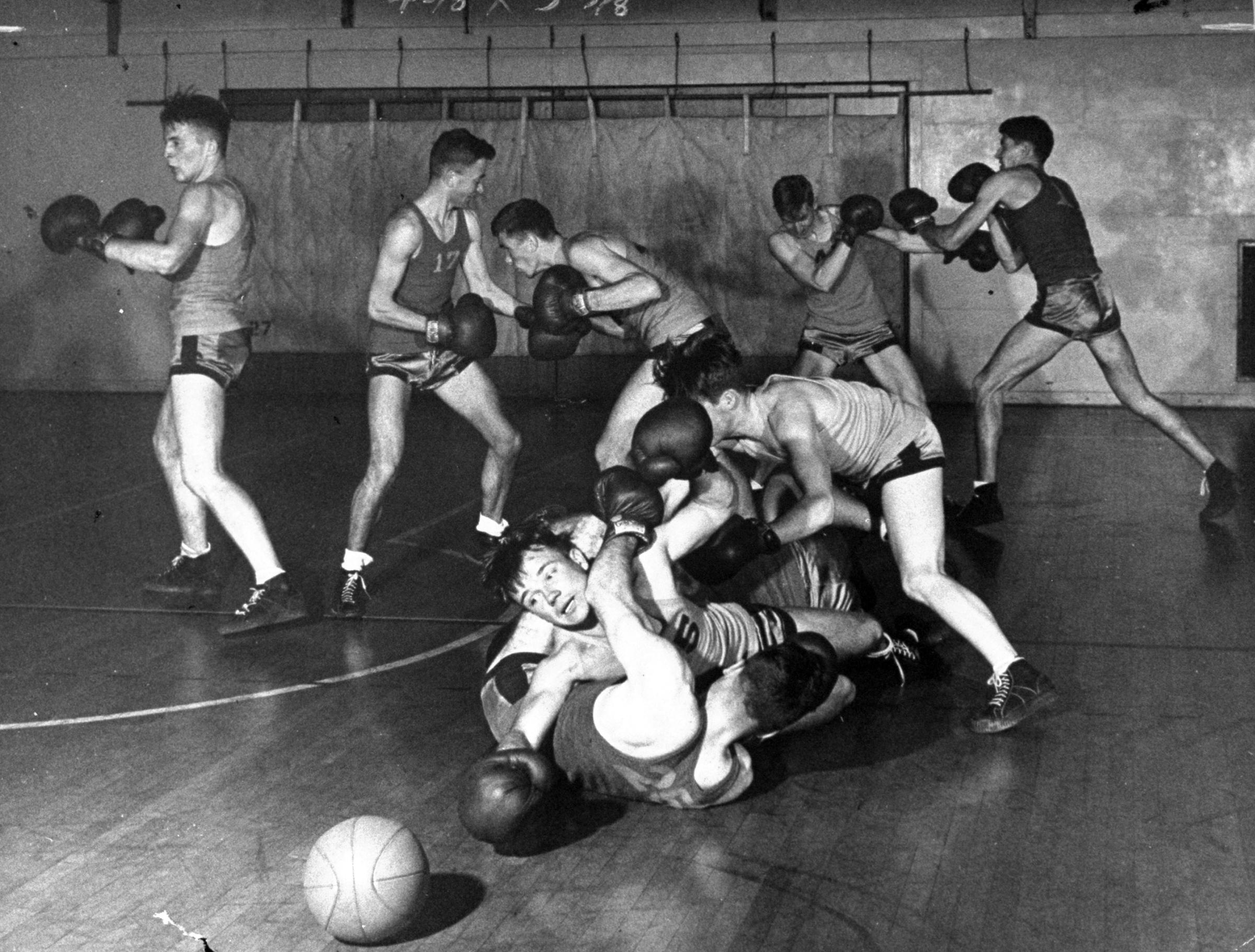 Mixing basketball and boxing at UCLA, 1945.