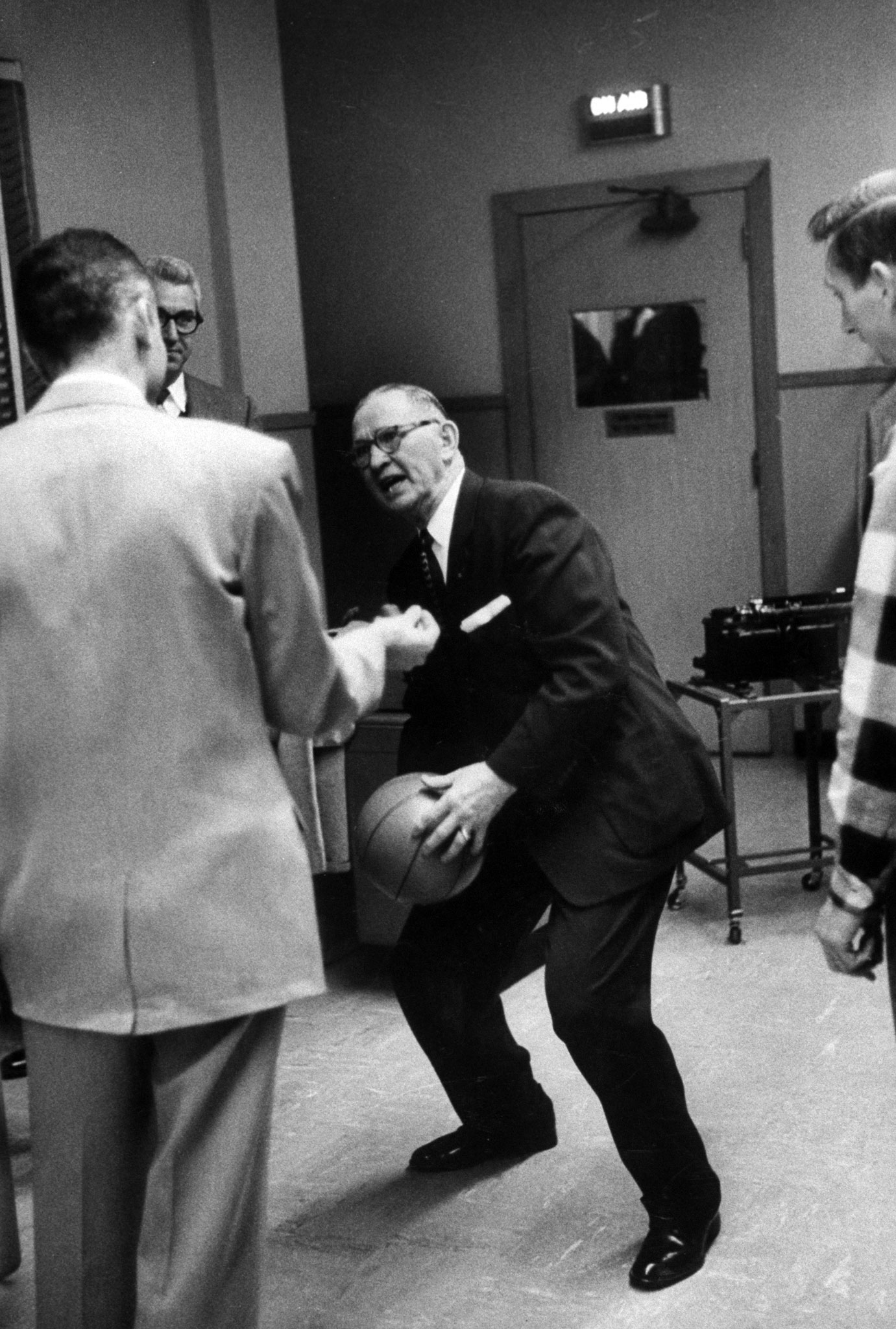 The legendary Kansas coach Forrest Allen, nicknamed "Phog," is often referred to as the "Father of Basketball Coaching," although these days not too many people mention him when discussing the greatest college coaches in history. Allen (here demonstrating some sort of funky move in 1957) coached Dean Smith; he recruited Wilt Chamberlain to Kansas; the Jayhawks' famous Allen Fieldhouse is named for him, and a banner hanging in the fieldhouse reads, "Pay heed all who enter, beware of the Phog."