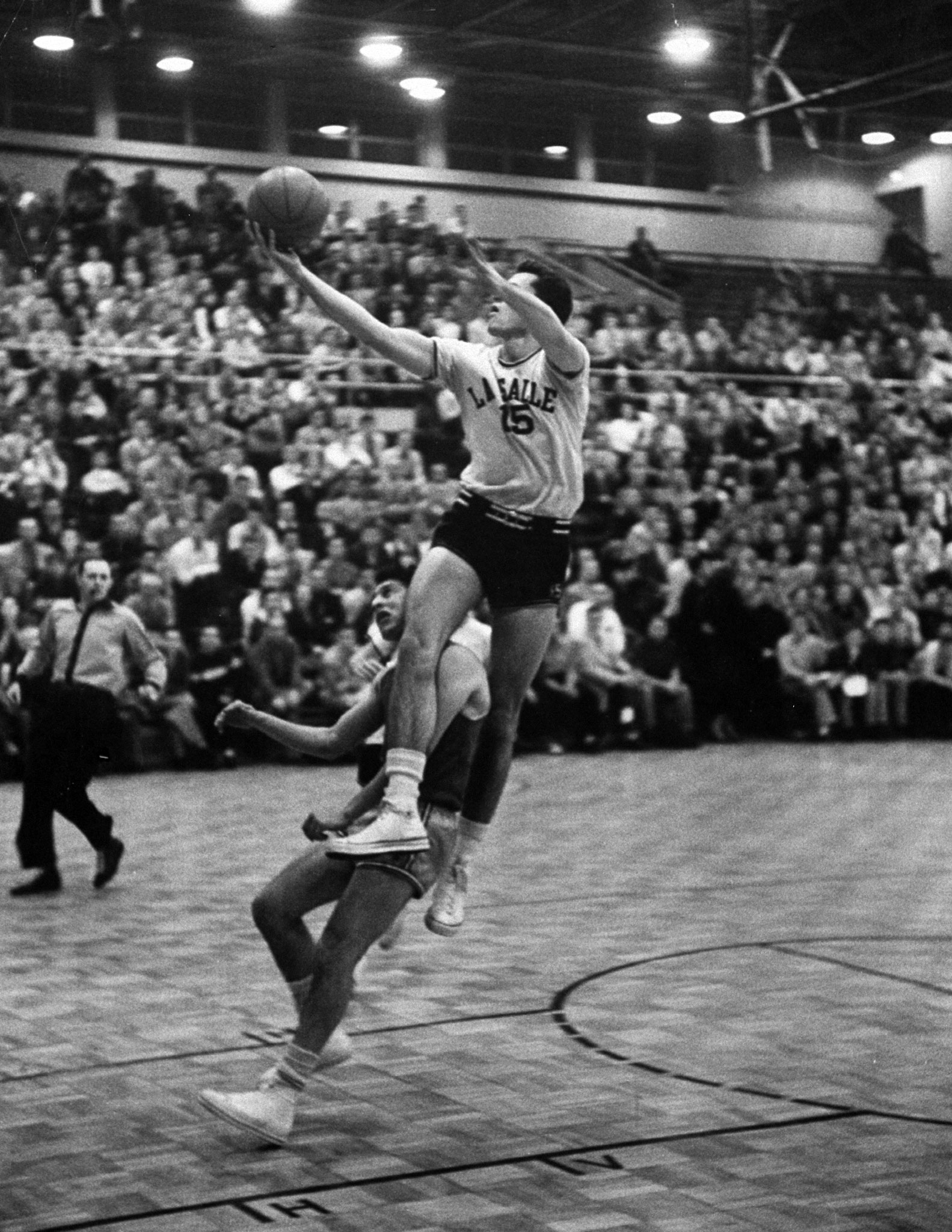 La Salle's Tom Gola (above, driving to the hoop in 1954) was one of the college game's earliest superstars, a do-it-all forward who still holds the Division I record for career rebounds (2,201). The four-time All-American also scored 2,462 points, for career averages of 20.9 points and 18.7 rebounds.