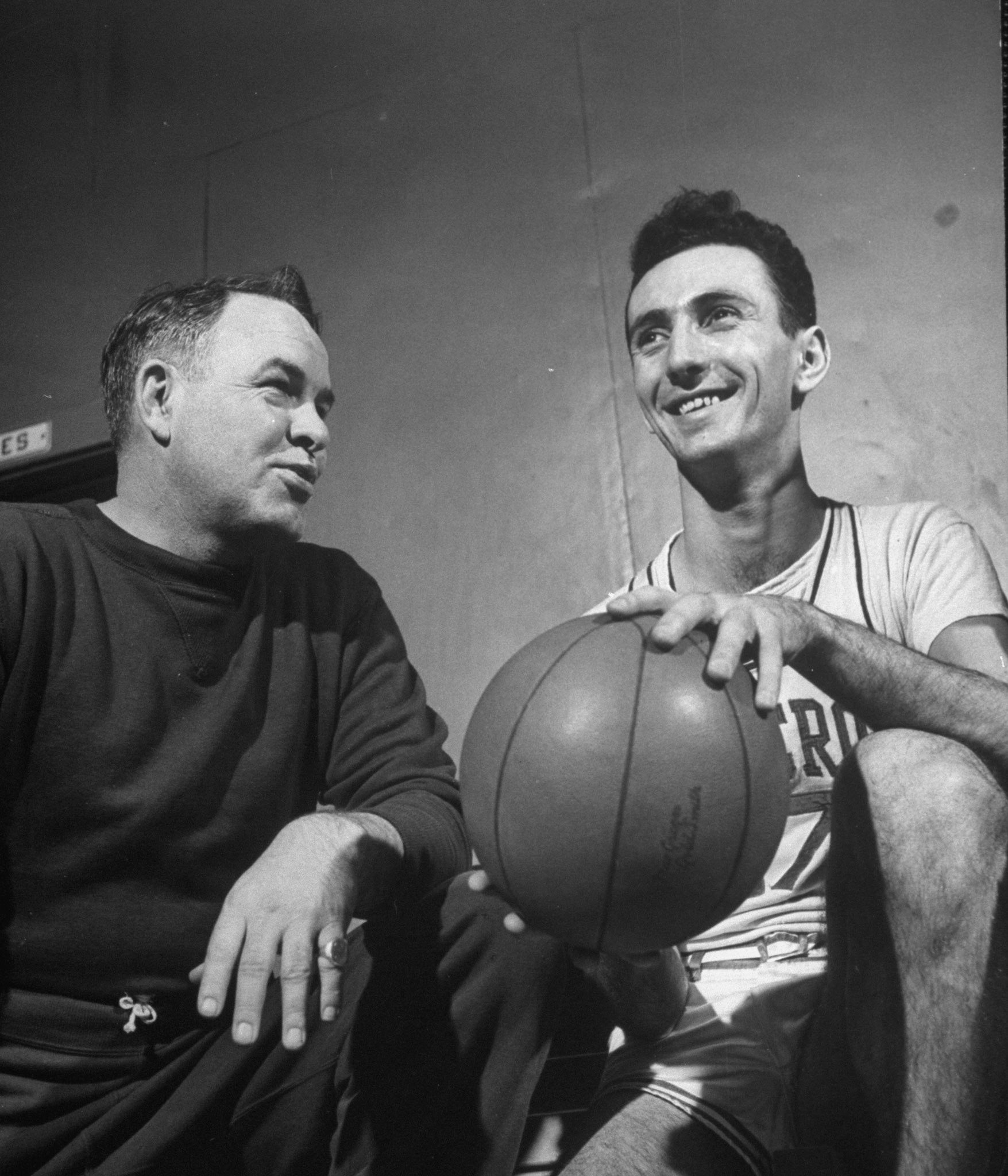 Bob Cousy (above, at right, in 1950 when he was with Holy Cross) brought a showman's flair to the sport before it was an accepted part of the game, regularly dribbling behind his back and throwing no-look passes. Known as the Houdini of the Hardwood, he was basketball's first great pure playmaker.