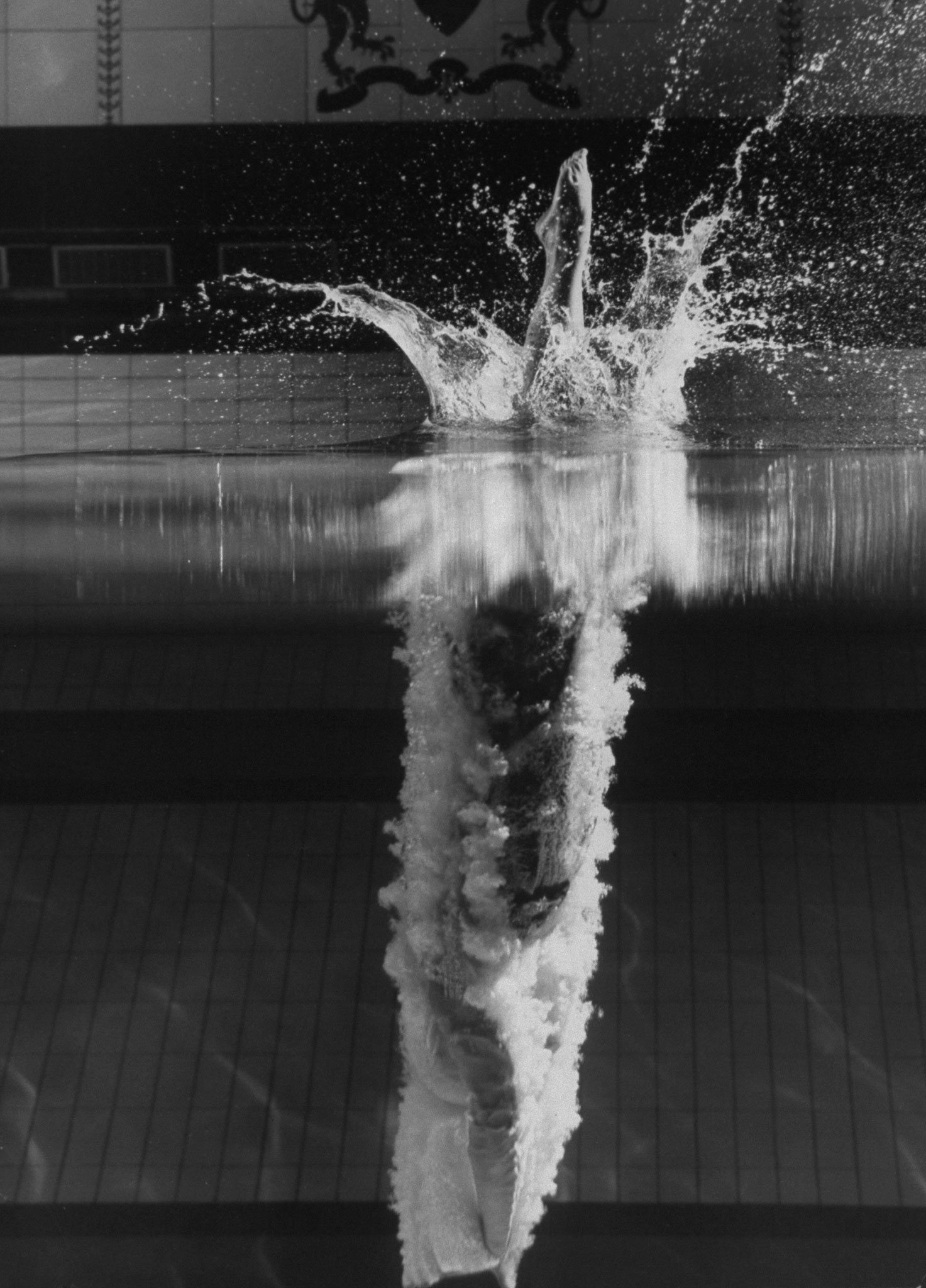 Kathy Flicker dives at Princeton University's Dillon Gym pool in 1962.