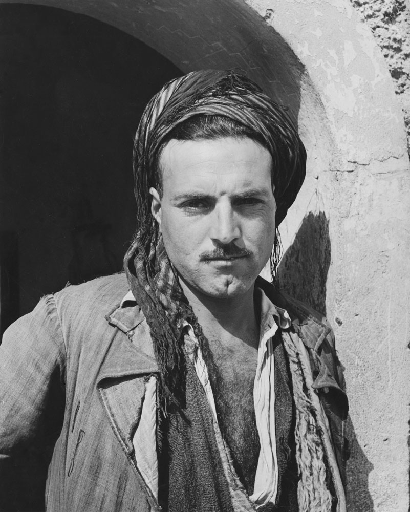 A Kurd guards the gate at Kirkuk, Iraq, 1945.