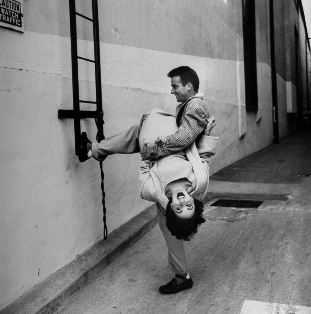 Elizabeth Taylor and Montgomery Clift goof around during a break in filming A Place in the Sun.
