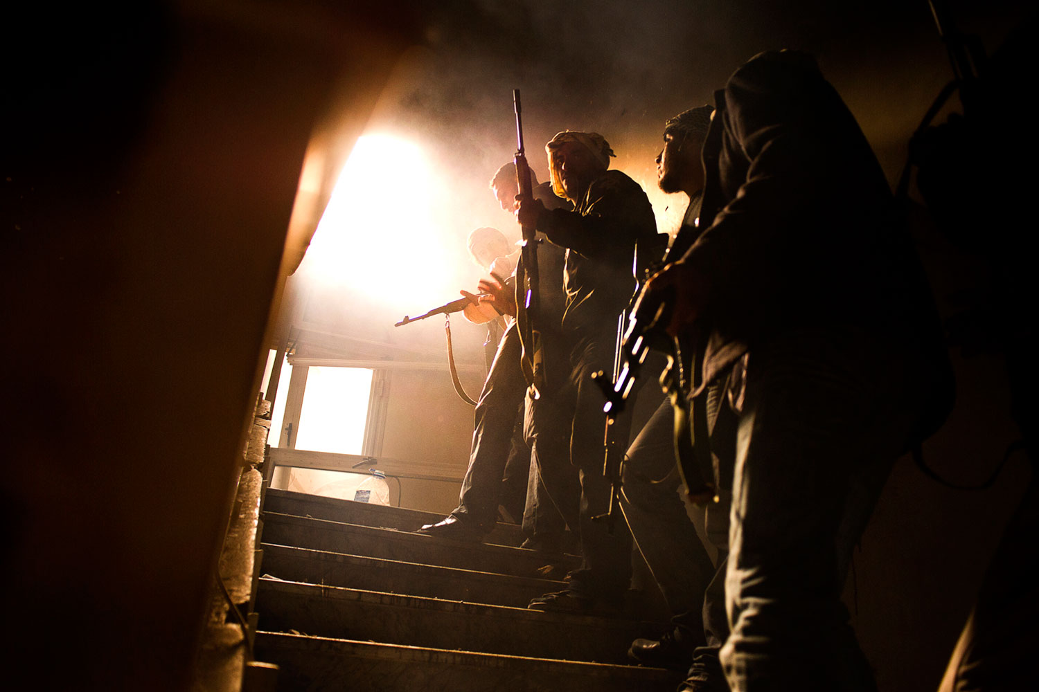April 24, 2011. Rebels fighting against pro-government soldiers inside a building in downtown Misurata, on Tripoli Street.