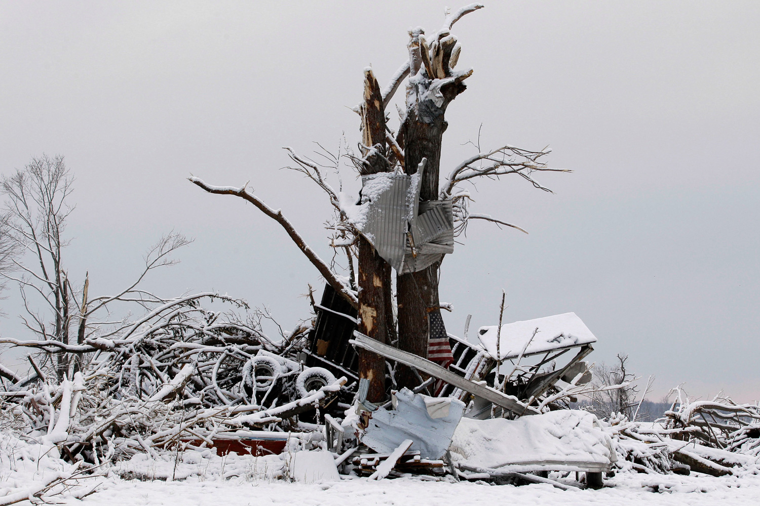 March 5, 2012. Snow covers a demolished house in Marysville, Ind. after a tornado ripped through the town.