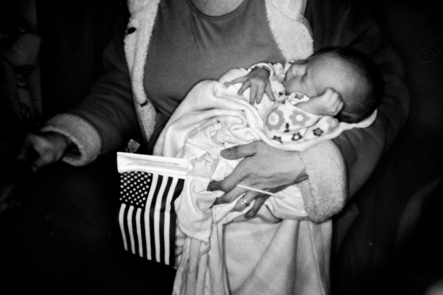 March 5, 2012. Amy Carney holds her 3-week-old daughter Anna during a rally at the American Legion in Westerville, Ohio.