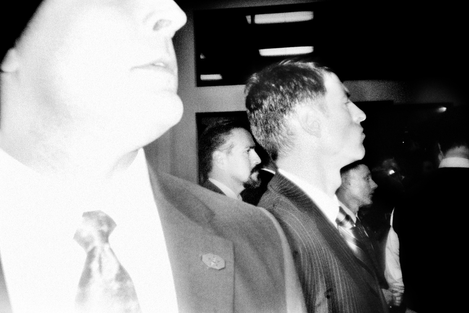 March 5, 2012. Secret service agents watch Rick Santorum as he greets supporters after speaking at a rally in Cuyahoga Falls, Ohio.