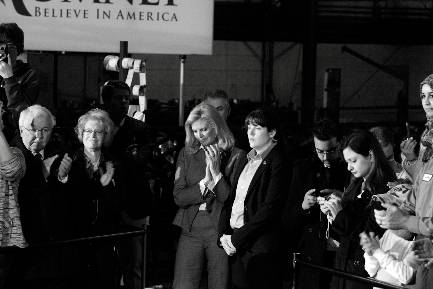 March 5, 2012. Ann Romney listens to her husband speech during a rally at Gregory Industries in Canton, Ohio.