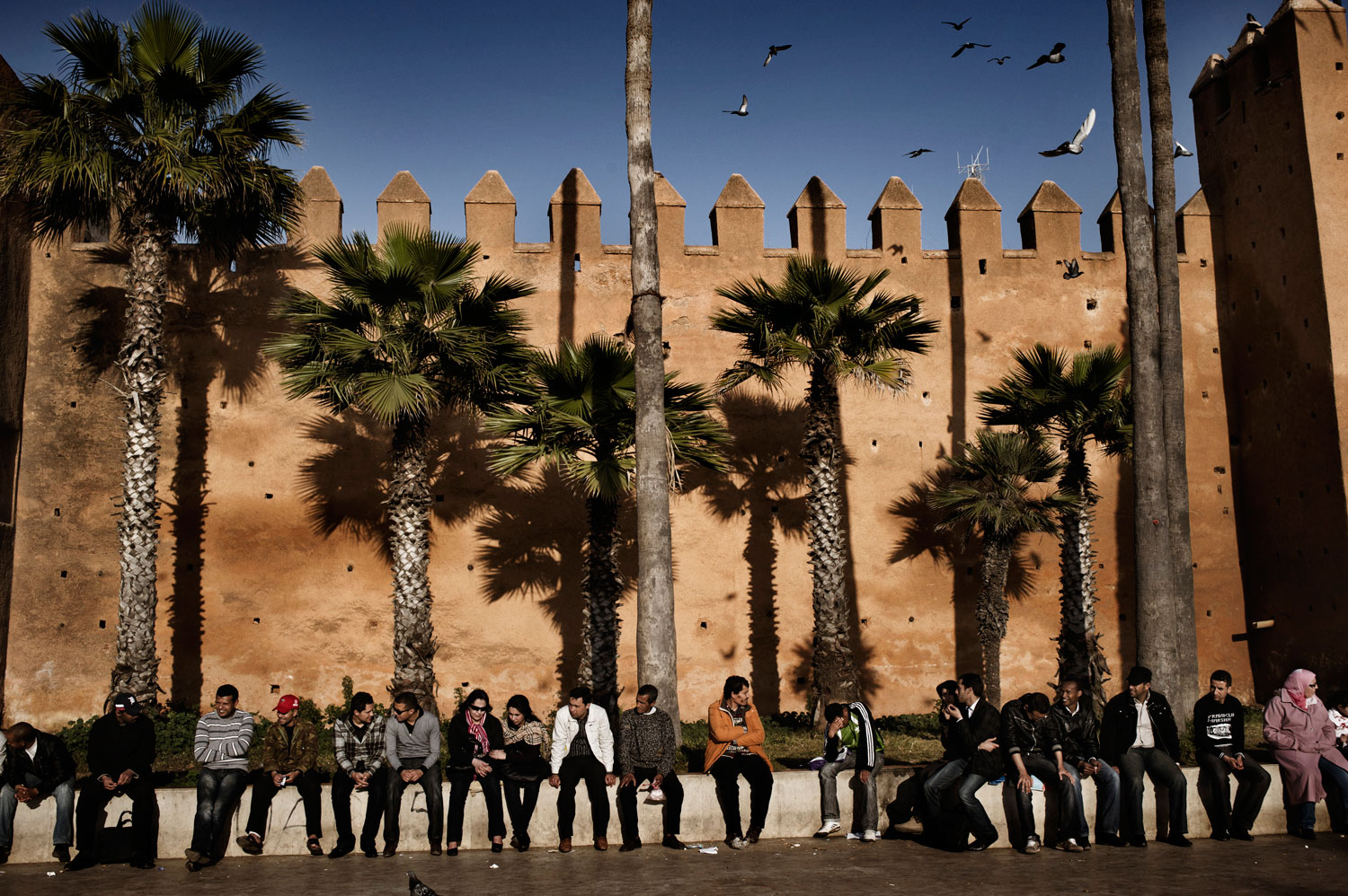 March 2012. Young Moroccans hang out in front of the Casbah of Oudaya, in a 12th-century fortress in Rabat, Morocco.