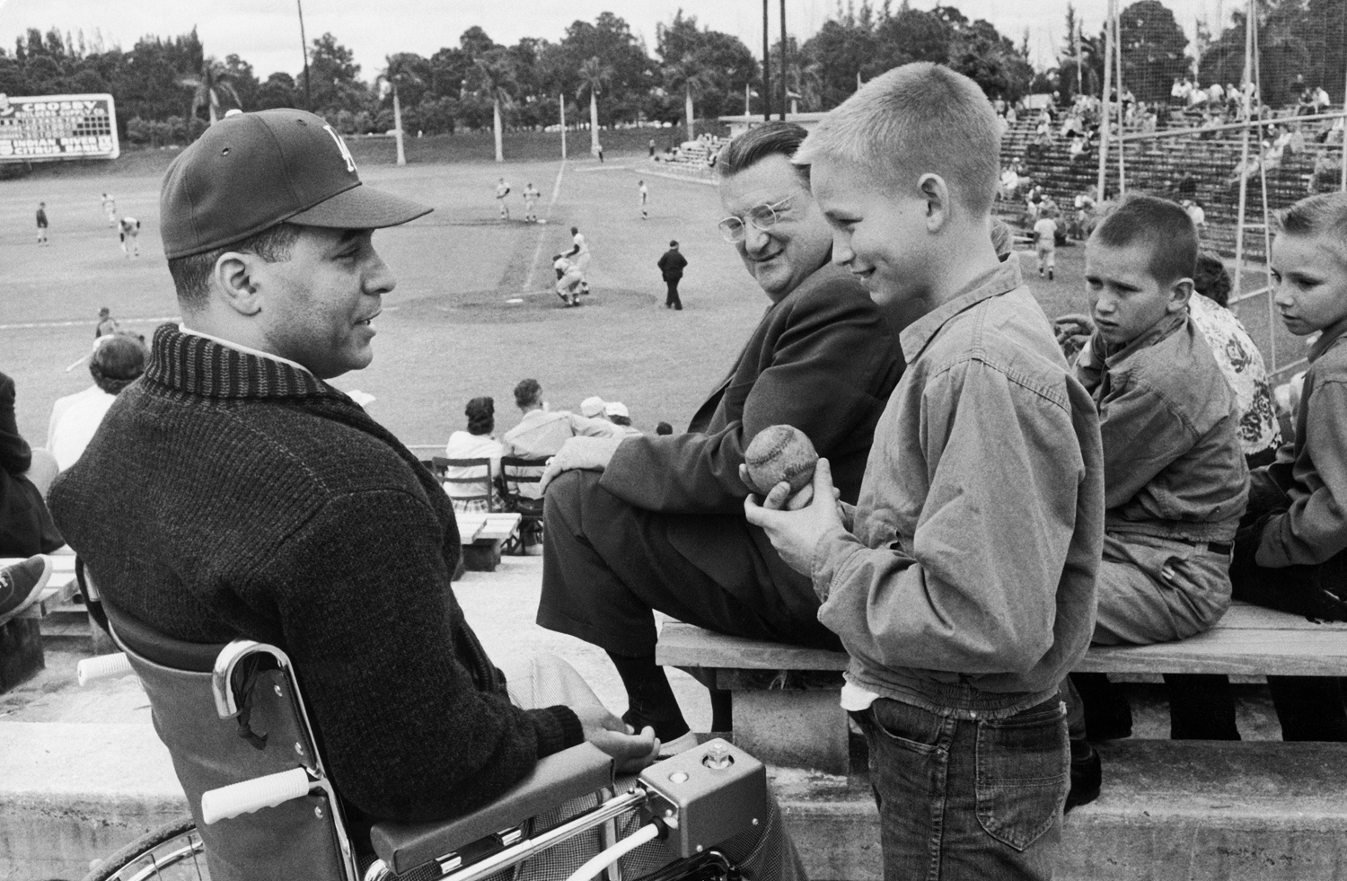Roy Campanella (left) talks with a young, awed fan during spring training in 1959.
