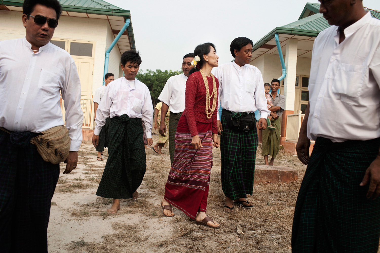 April 1, 2012. Aung San Suu Kyi, center, visits a polling station in Kawhmu, Myanmar.